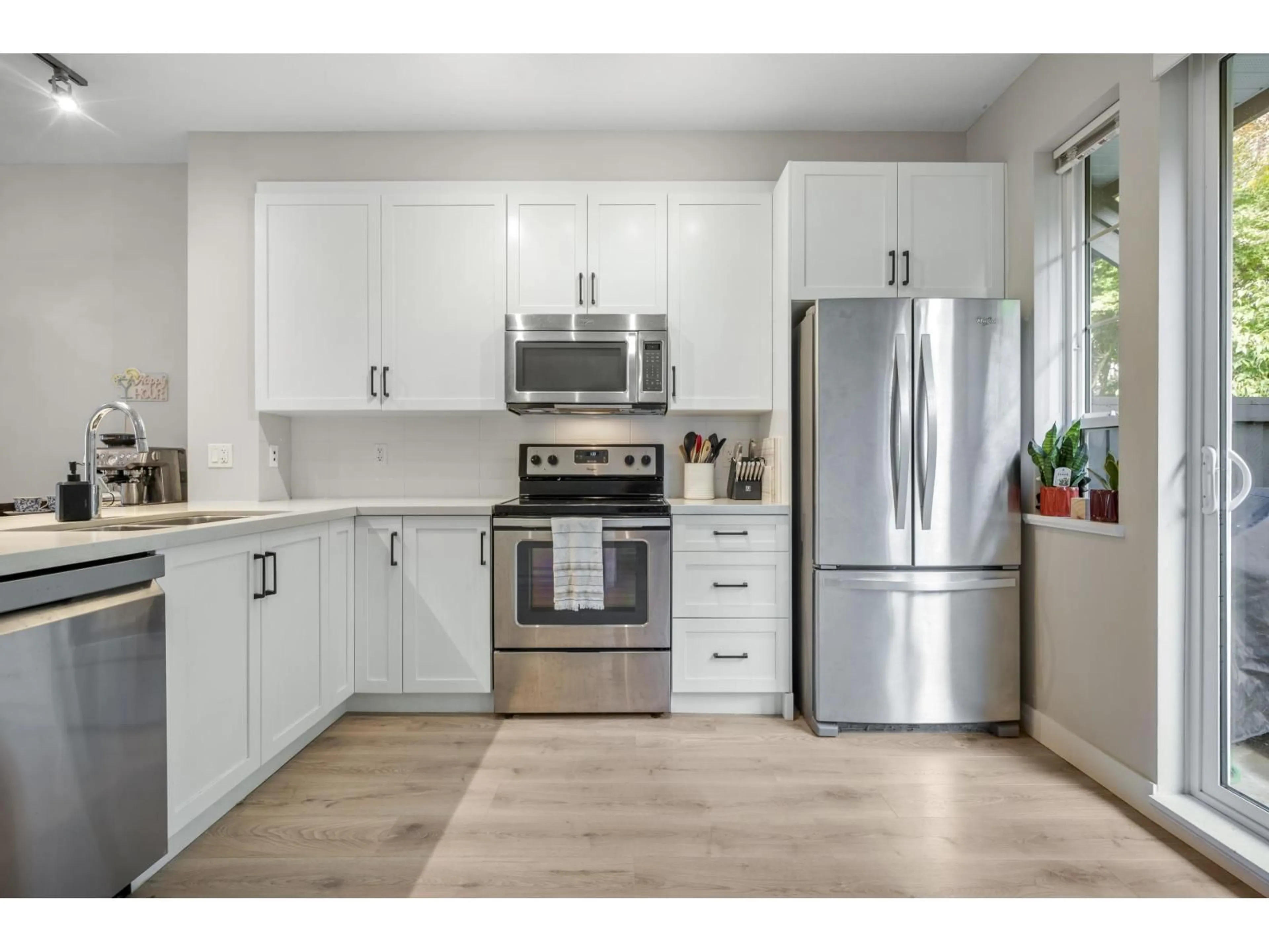 Open concept kitchen, wood/laminate floor for 52 - 4967 220 STREET, Langley British Columbia V3A0G3