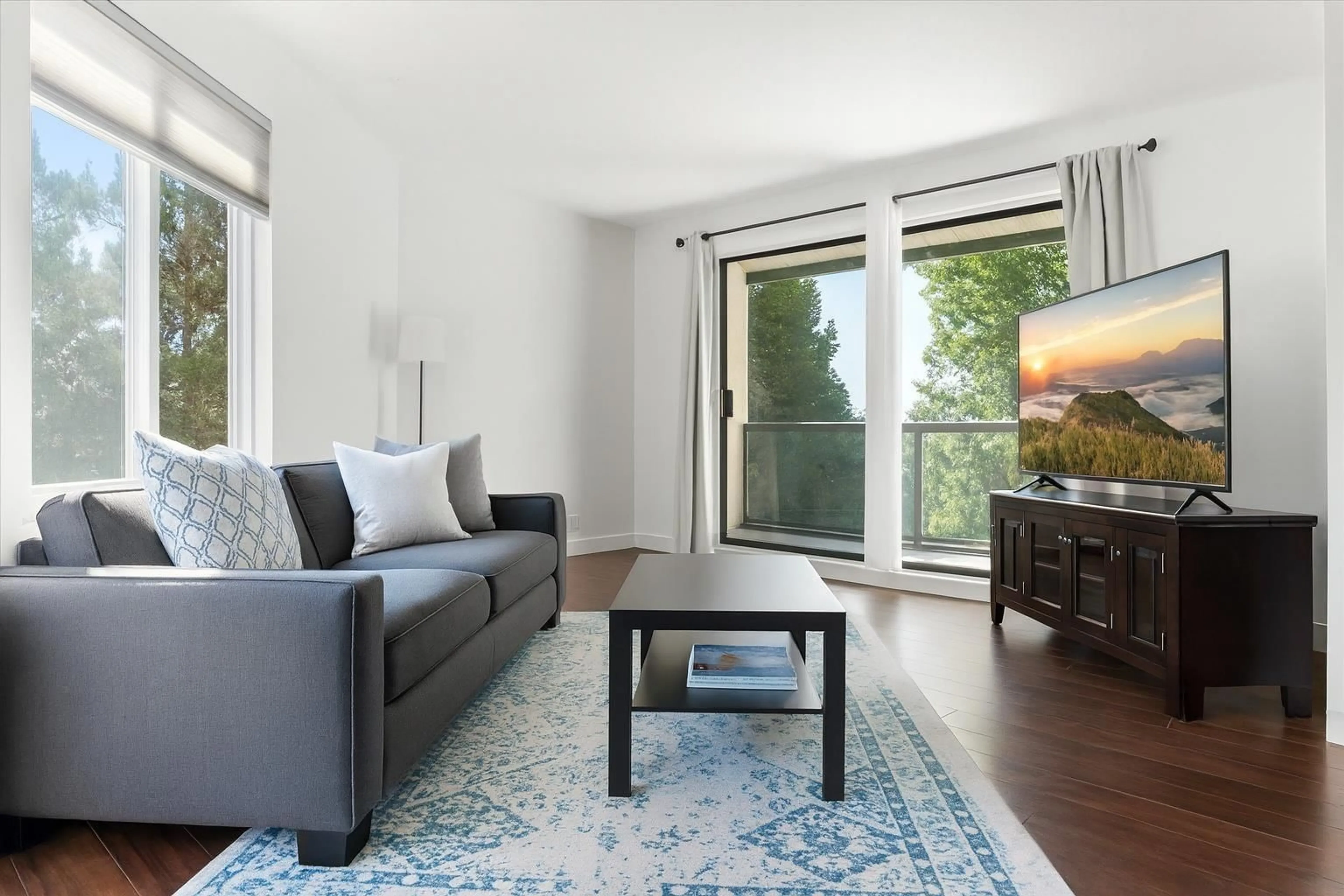 Living room with furniture, wood/laminate floor for 301 - 33598 GEORGE FERGUSON WAY, Abbotsford British Columbia V2S2L8