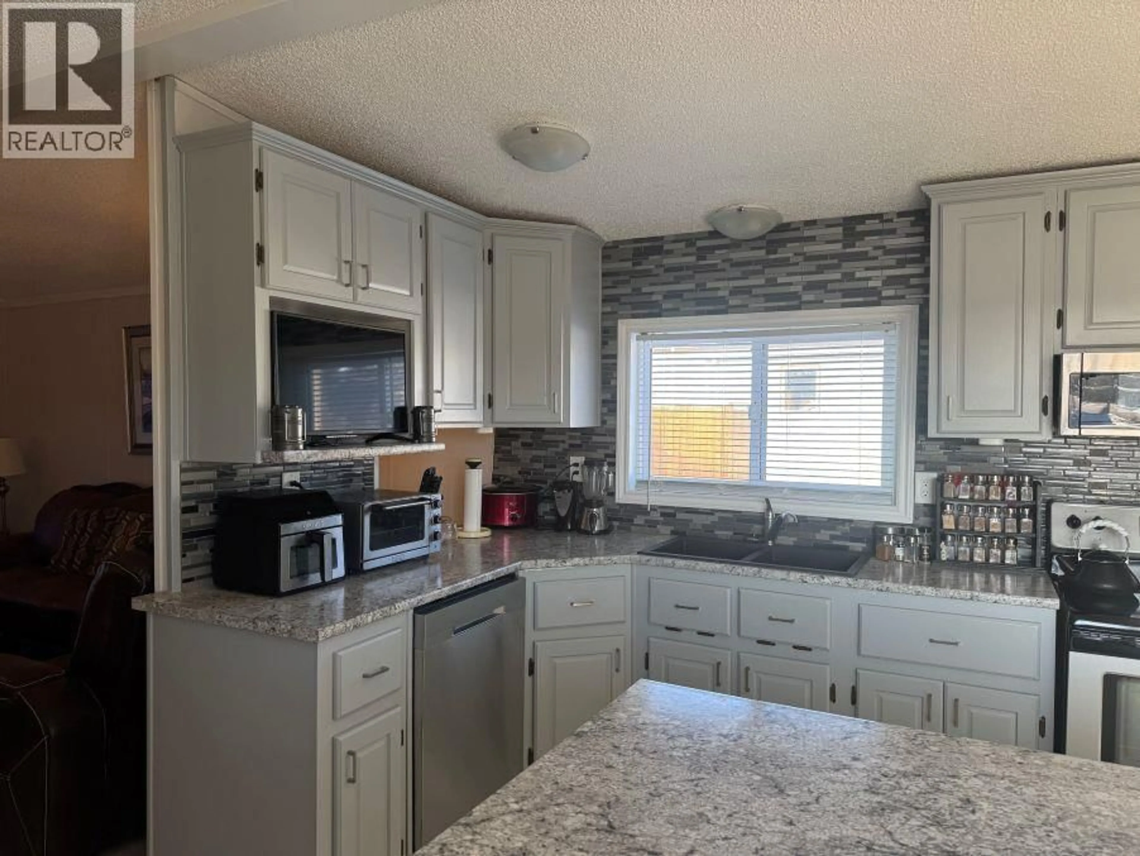 Open concept kitchen, ceramic/tile floor for 301 BLACKBURN ROAD, Prince George British Columbia V2N6G1