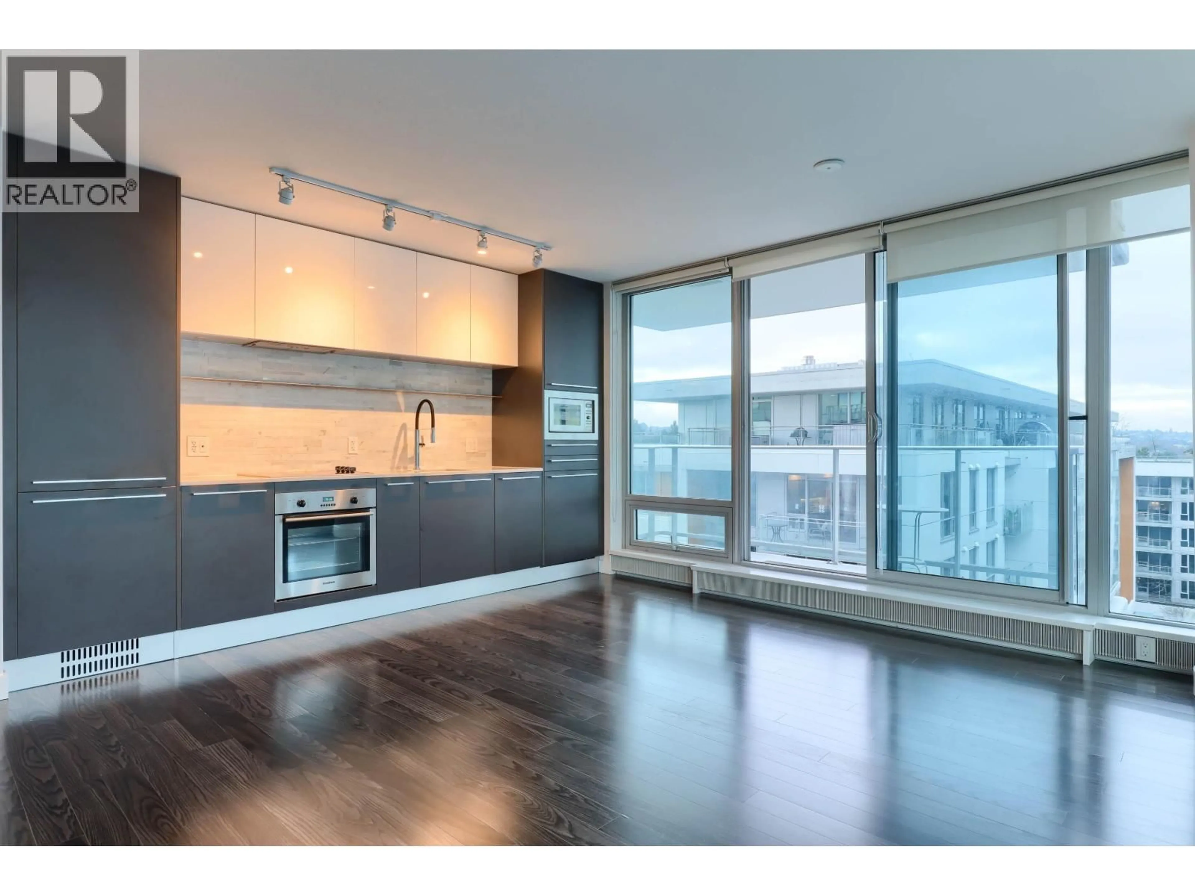 Open concept kitchen, wood/laminate floor for 606 - 8031 NUNAVUT LANE, Vancouver British Columbia V5X0C9