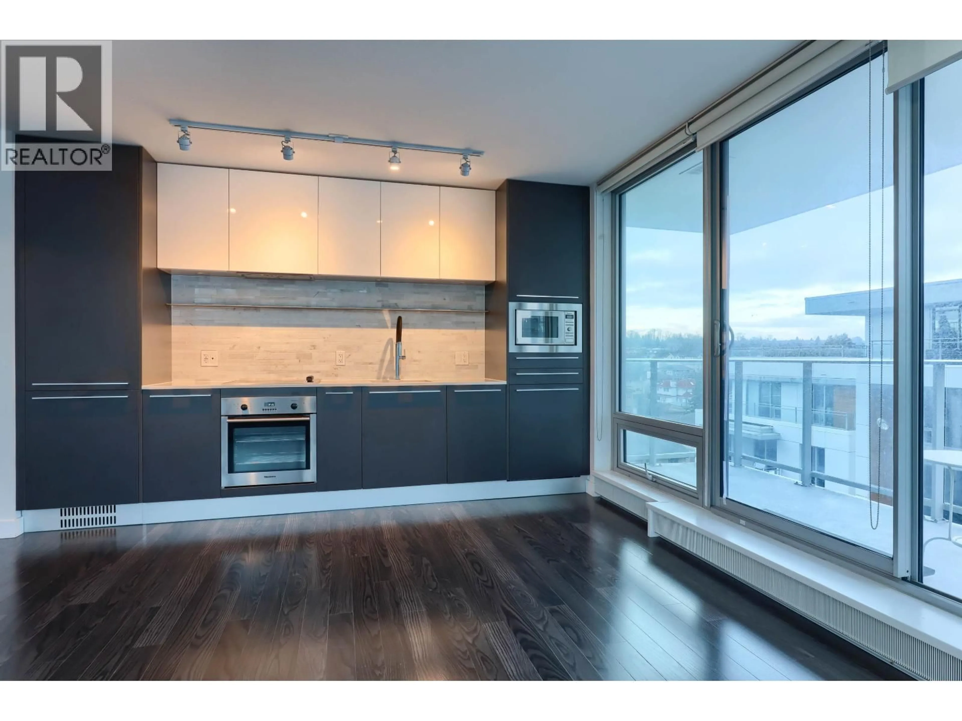 Open concept kitchen, wood/laminate floor for 606 - 8031 NUNAVUT LANE, Vancouver British Columbia V5X0C9