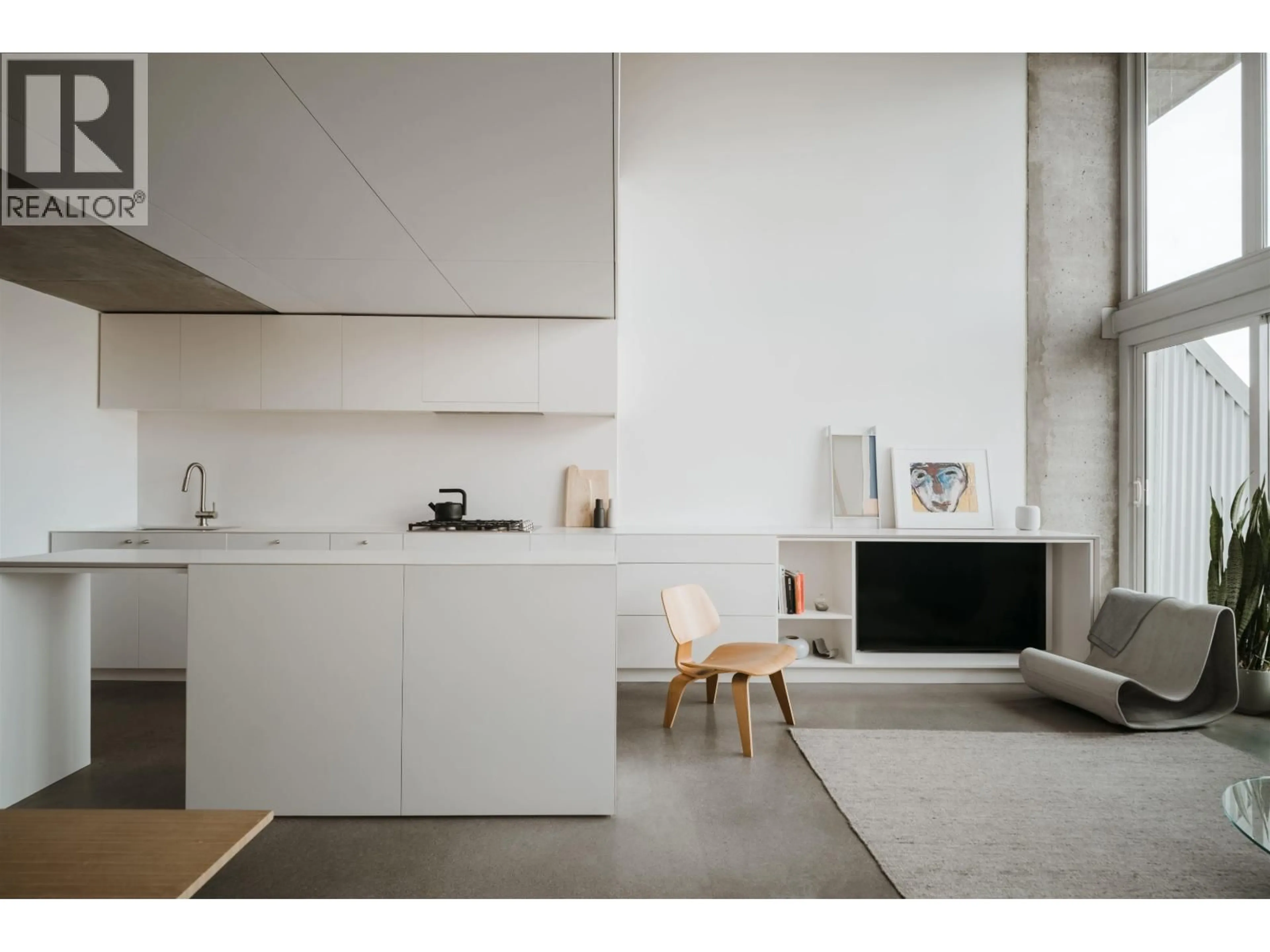 Open concept kitchen, cement floor for 405 - 289 ALEXANDER STREET, Vancouver British Columbia V6A4H6