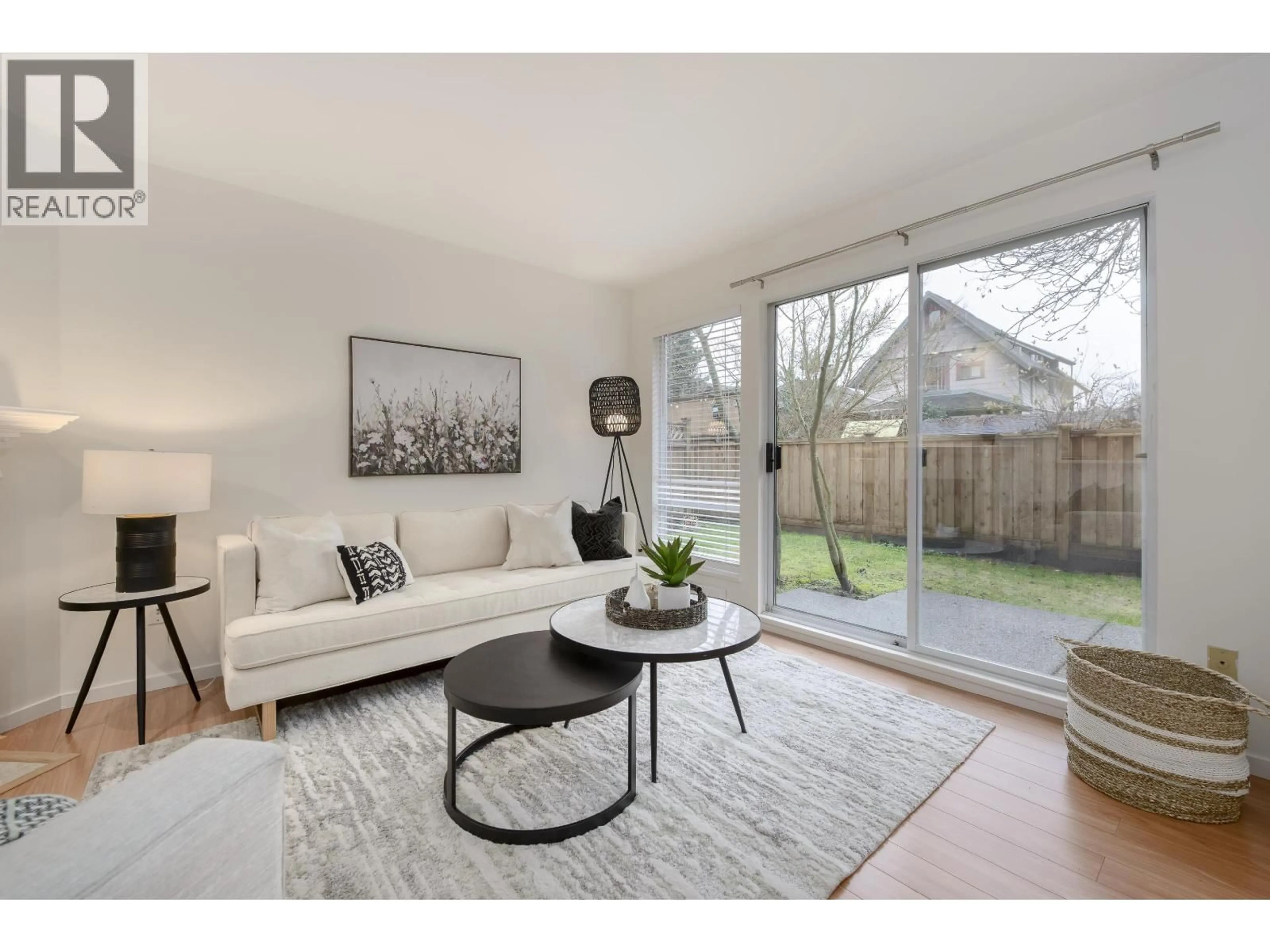 Living room with furniture, wood/laminate floor for 6 - 4245 SOPHIA STREET, Vancouver British Columbia V5V3V6