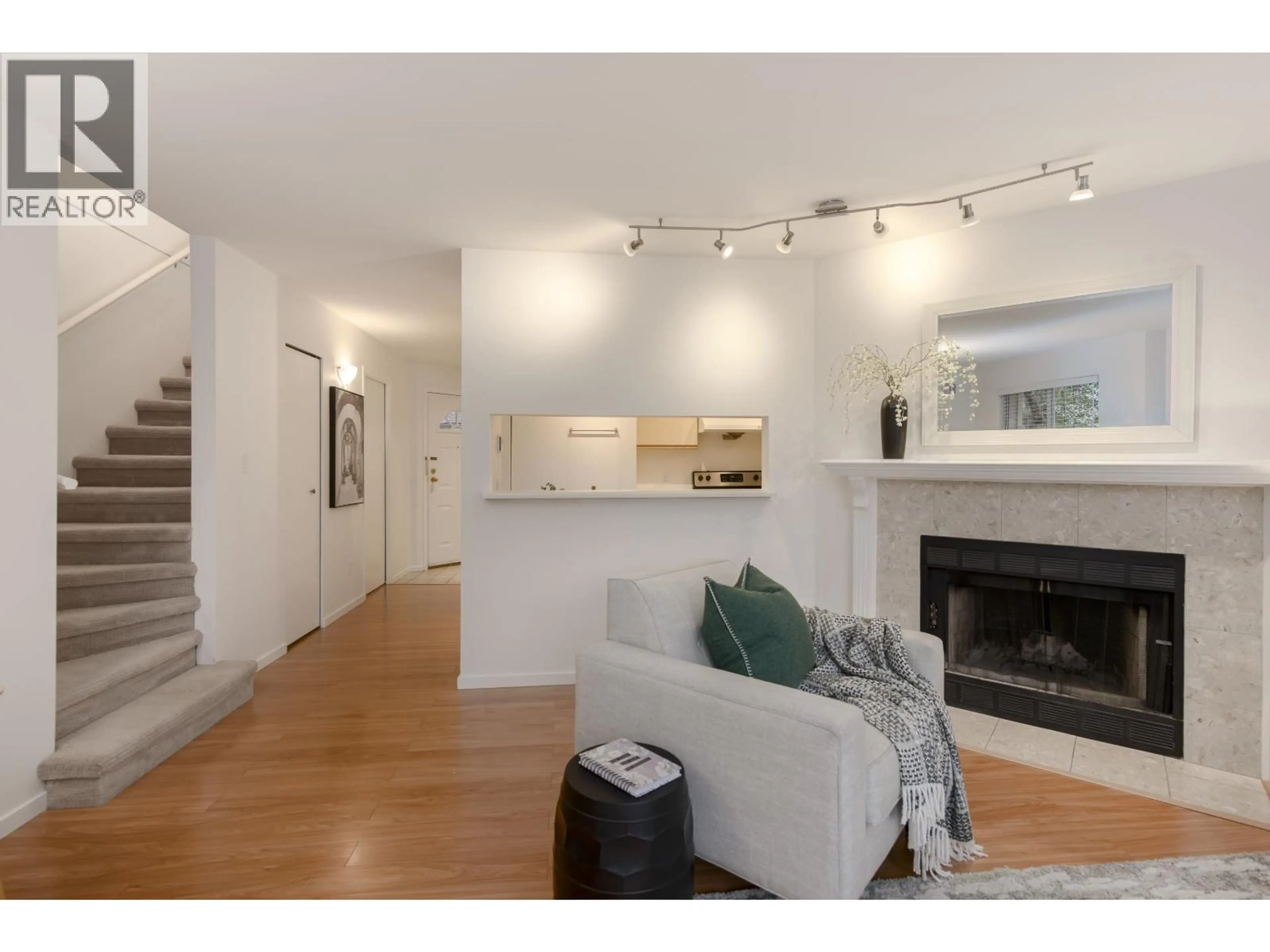 Living room with furniture, wood/laminate floor for 6 - 4245 SOPHIA STREET, Vancouver British Columbia V5V3V6