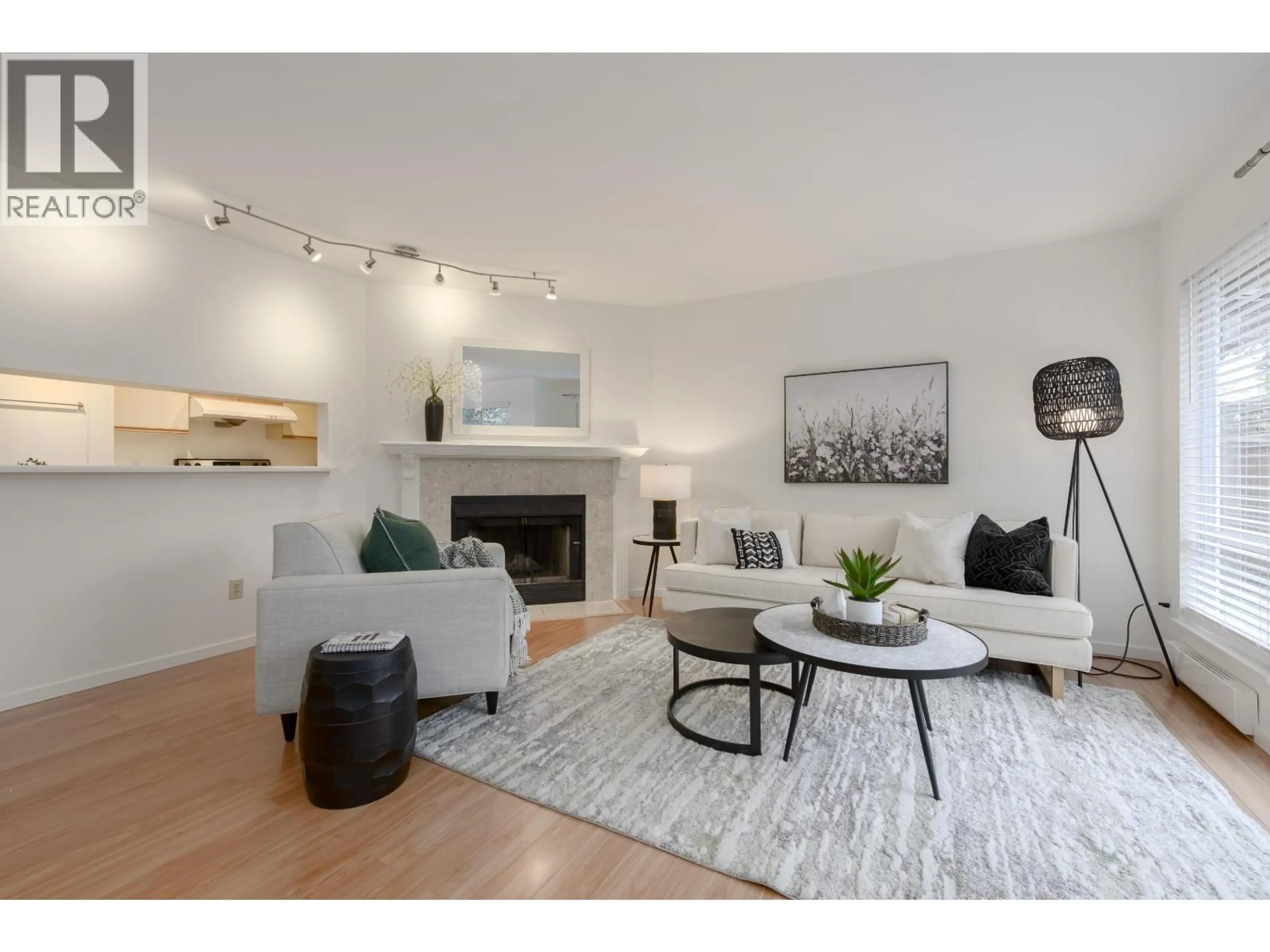 Living room with furniture, wood/laminate floor for 6 - 4245 SOPHIA STREET, Vancouver British Columbia V5V3V6