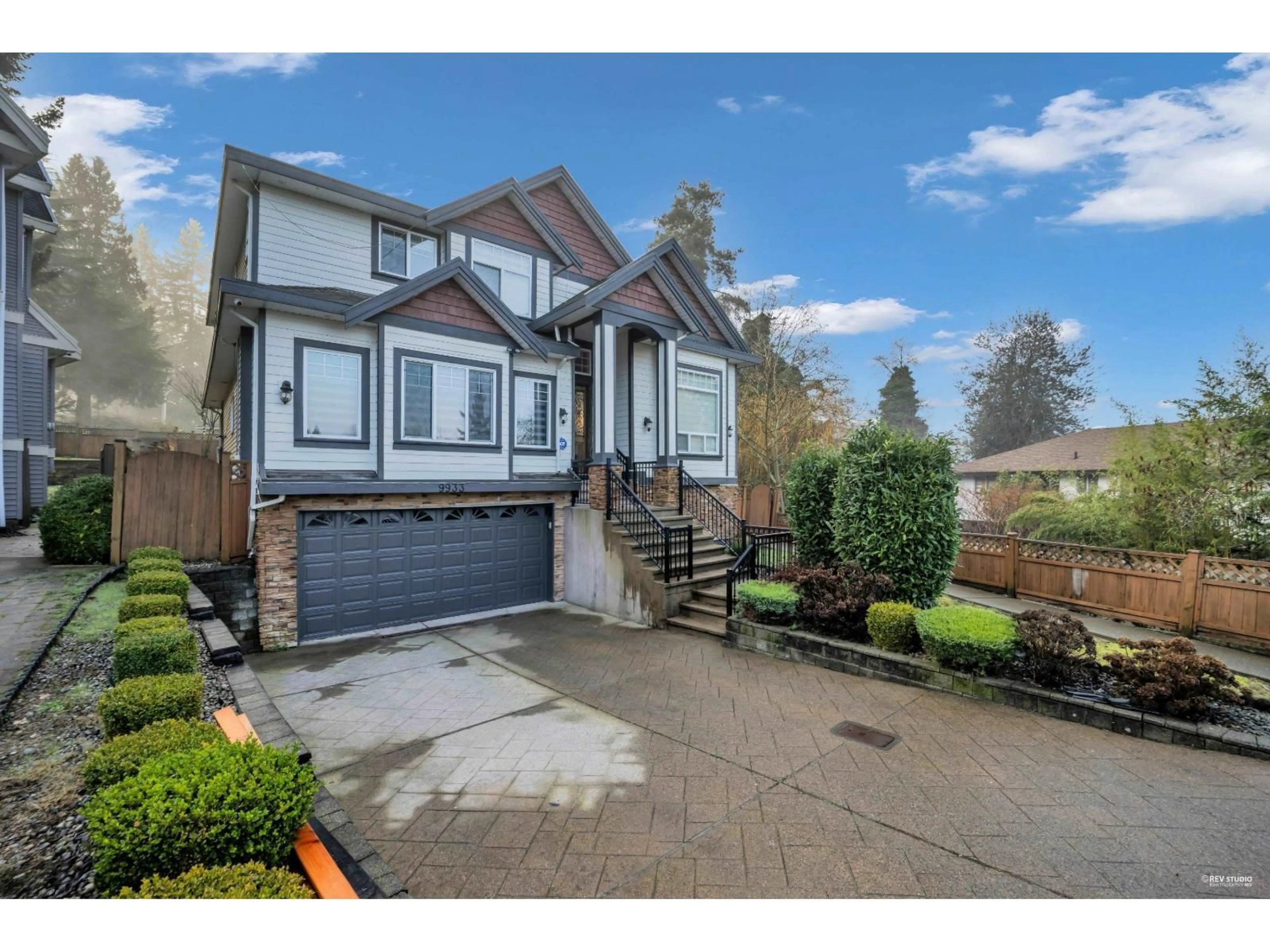 Home with vinyl exterior material, street for 9933 116A STREET, Surrey British Columbia V3V7K5