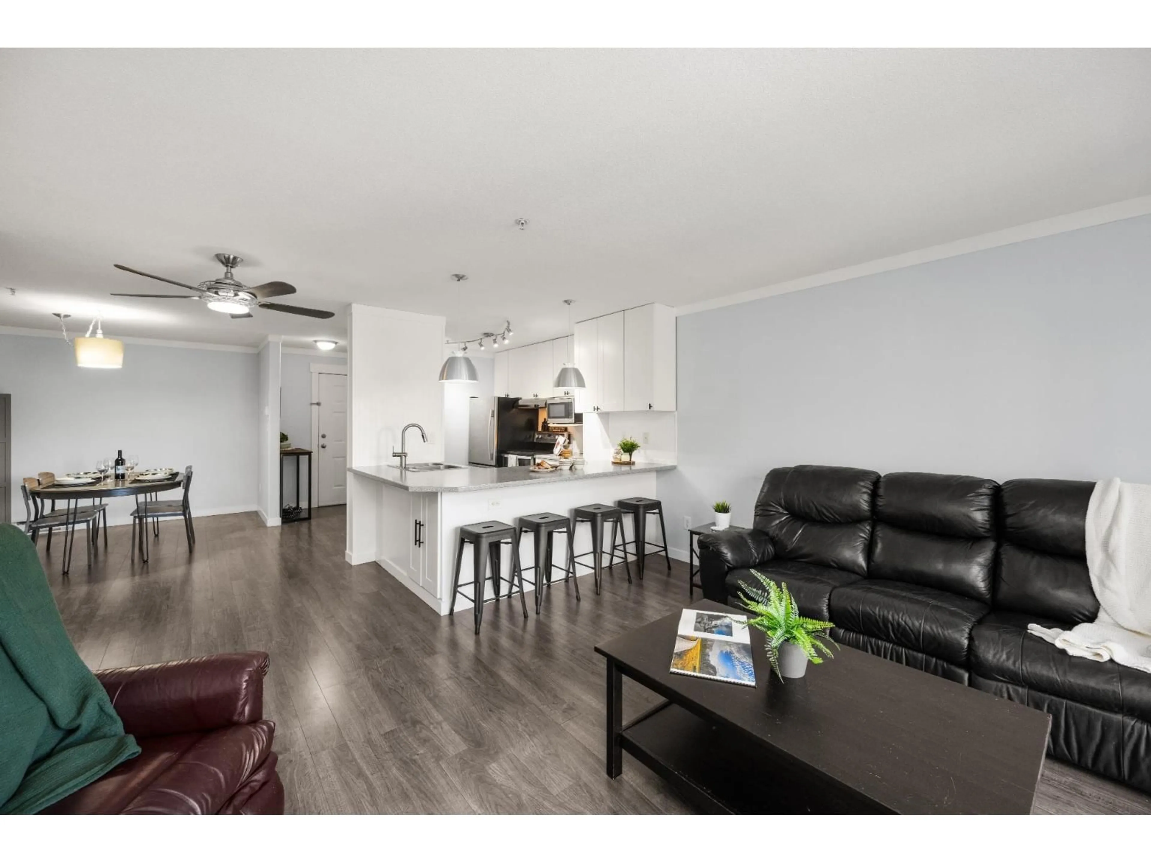 Open concept kitchen, wood/laminate floor for 323 - 22150 48 AVENUE, Langley British Columbia V3A8R5