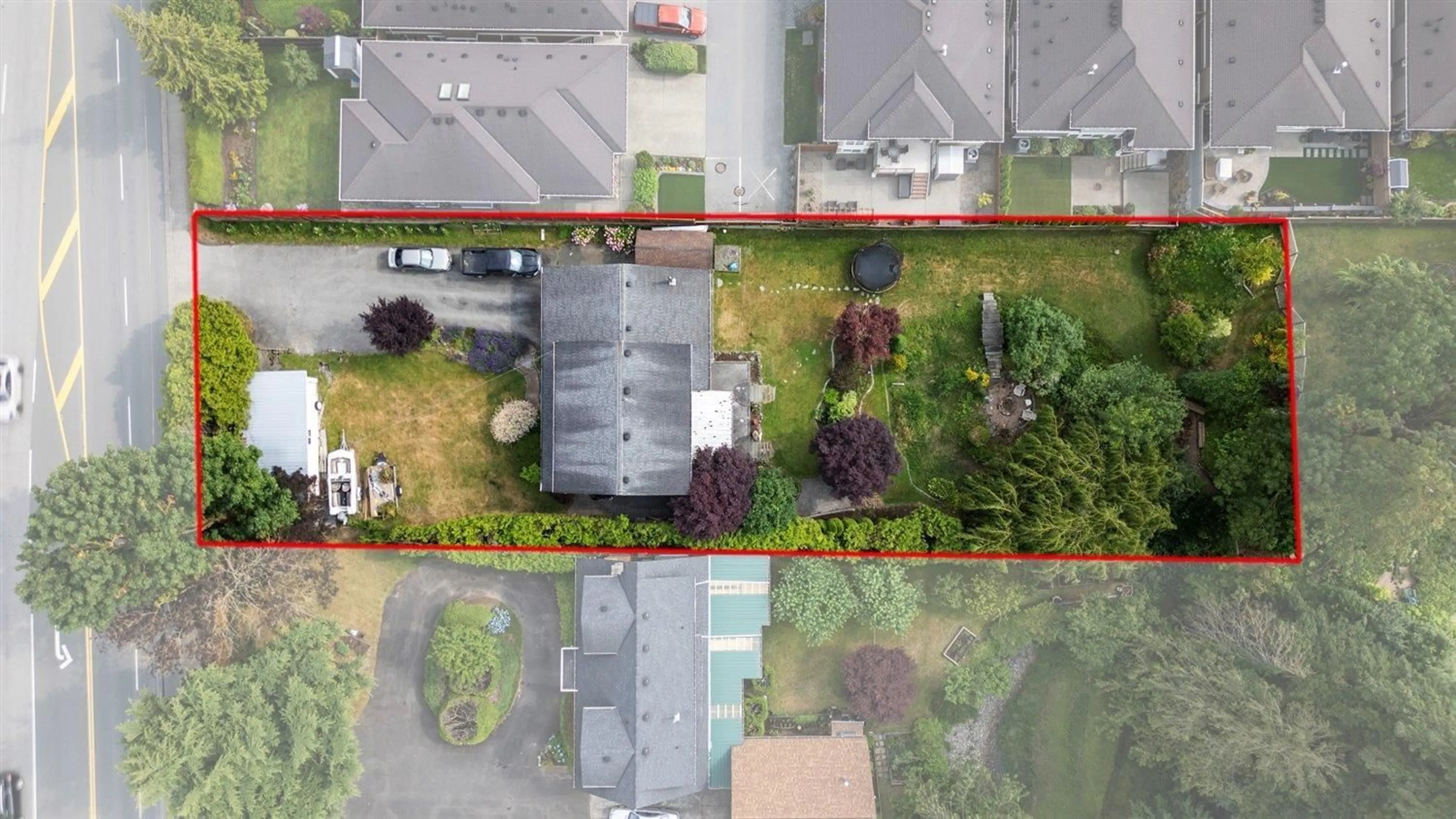 A pic from outside/outdoor area/front of a property/back of a property/a pic from drone, street for 6595 VEDDER ROAD, Chilliwack British Columbia V2R1C9