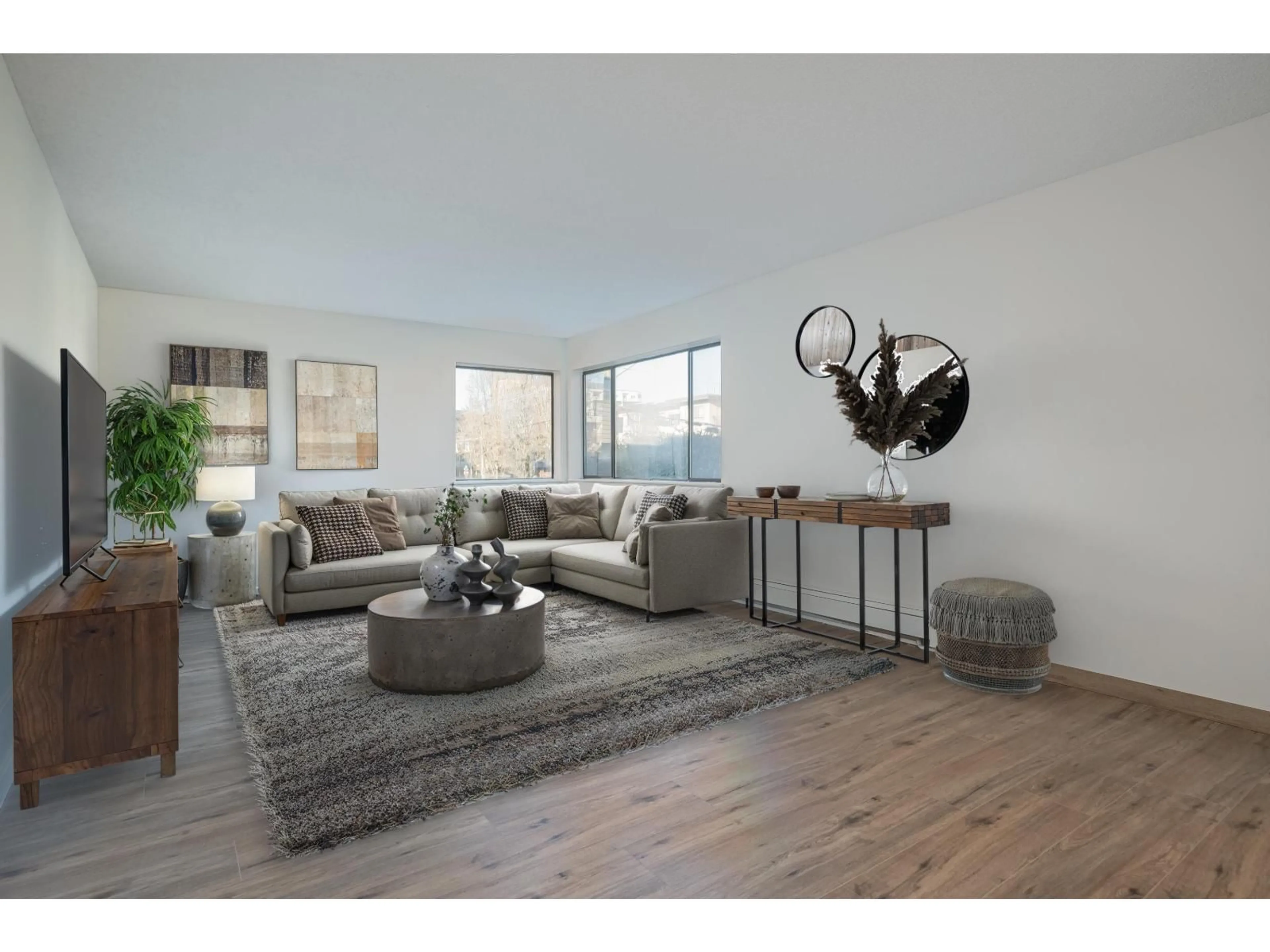 Living room with furniture, wood/laminate floor for 105 - 20460 54TH AVENUE, Langley British Columbia V3A6N6