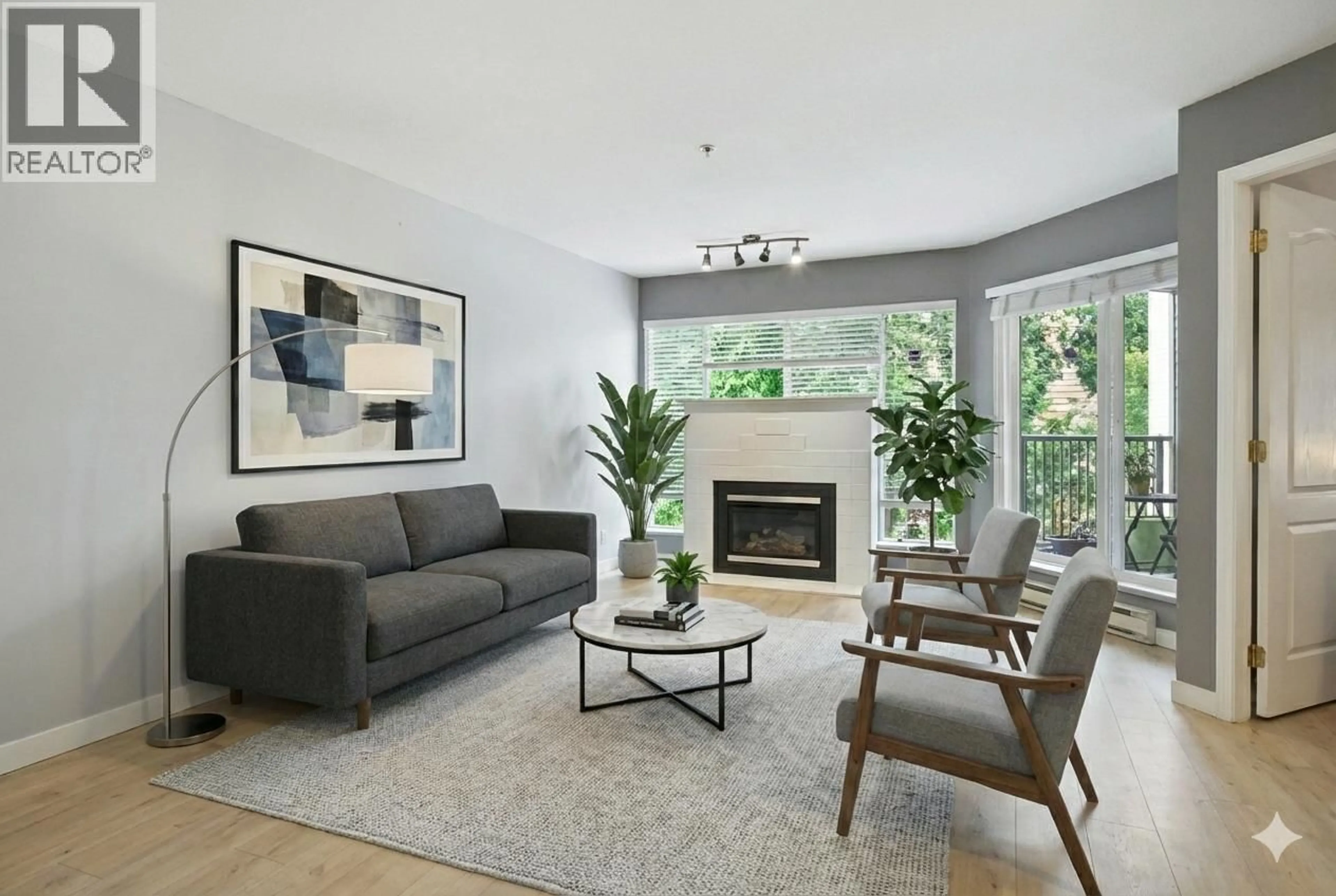 Living room with furniture, unknown for 209 - 2401 HAWTHORNE AVENUE, Port Coquitlam British Columbia V3C6E9