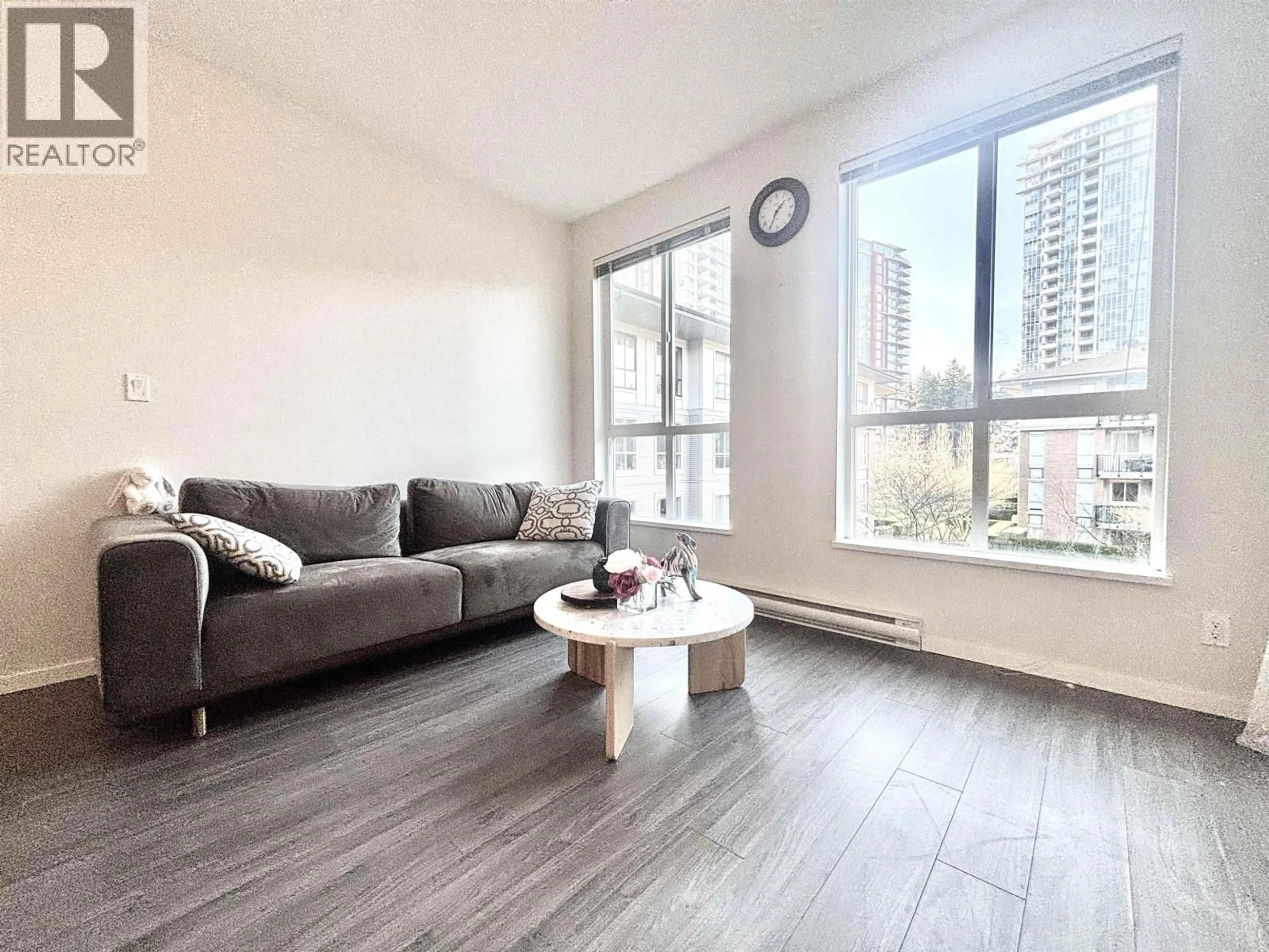 Living room with furniture, wood/laminate floor for 309 - 3107 WINDSOR GATE, Coquitlam British Columbia V3B0L1