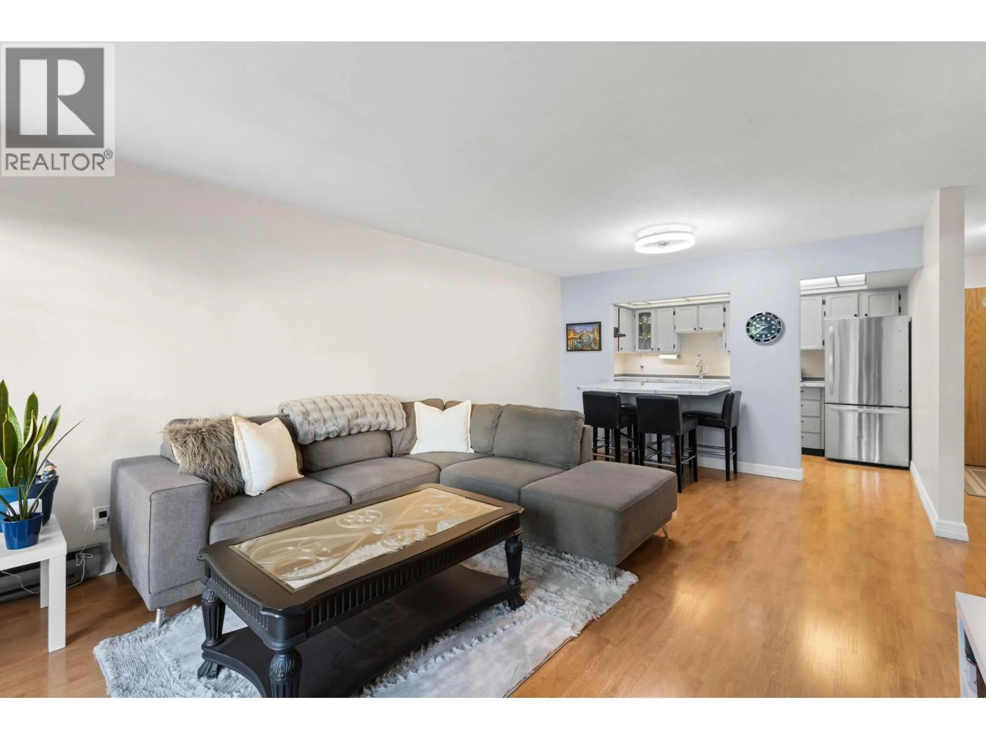 Living room with furniture, wood/laminate floor for 310 - 5335 HASTINGS STREET, Burnaby British Columbia V5B1P9