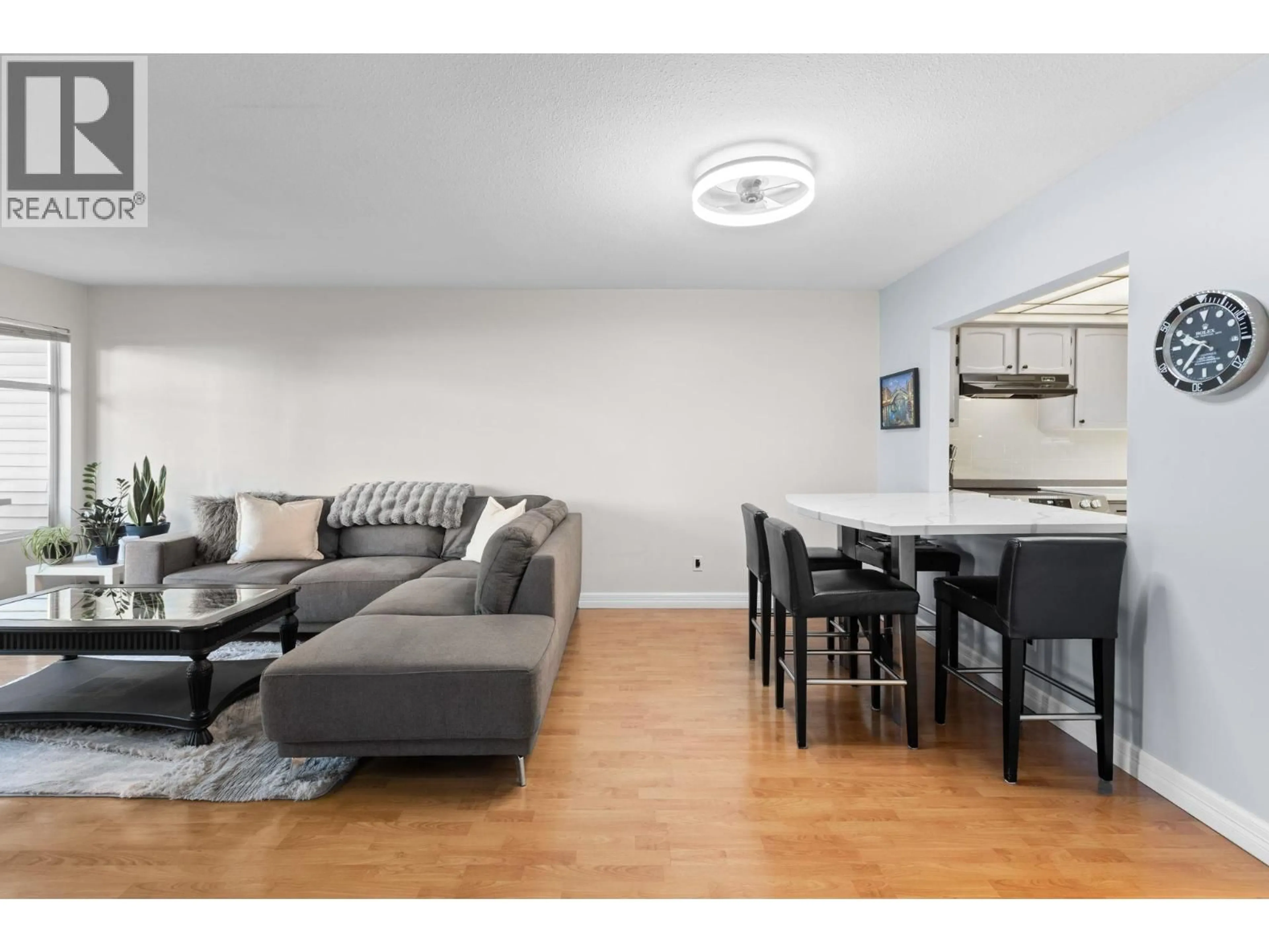 Living room with furniture, wood/laminate floor for 310 - 5335 HASTINGS STREET, Burnaby British Columbia V5B1P9