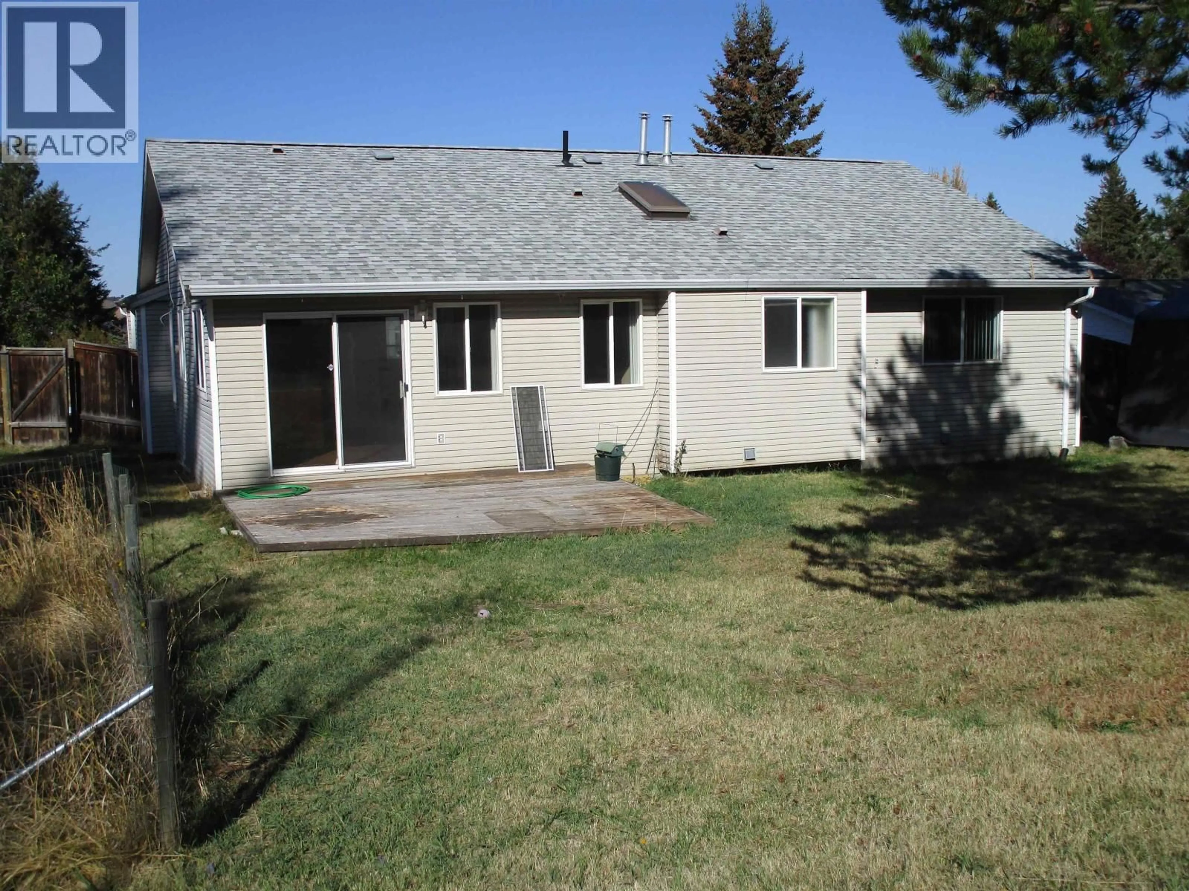 A pic from outside/outdoor area/front of a property/back of a property/a pic from drone, street for 908 JENS STREET, 100 Mile House British Columbia V0K2E0