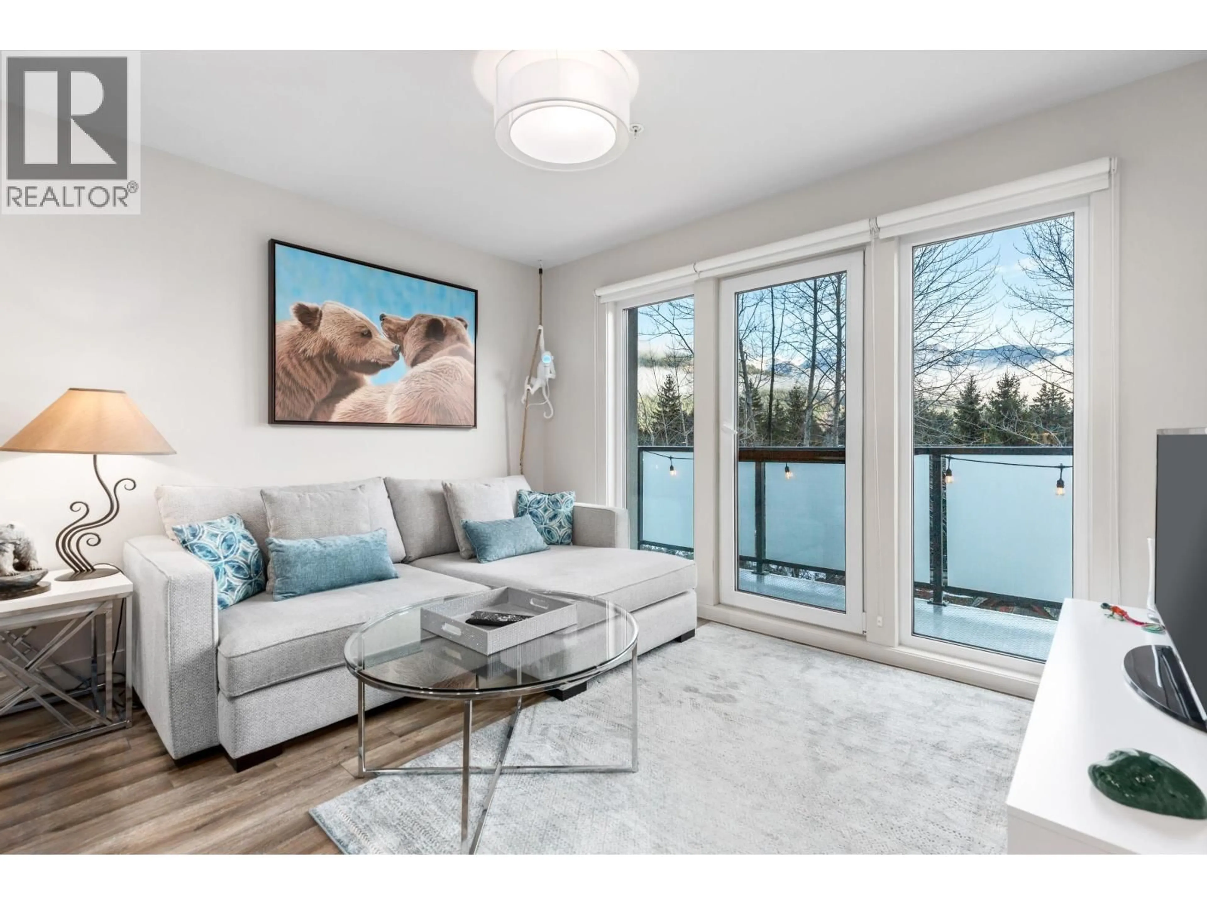 Living room with furniture, wood/laminate floor for 313 - 7350 CRABAPPLE COURT, Pemberton British Columbia V0N2L1