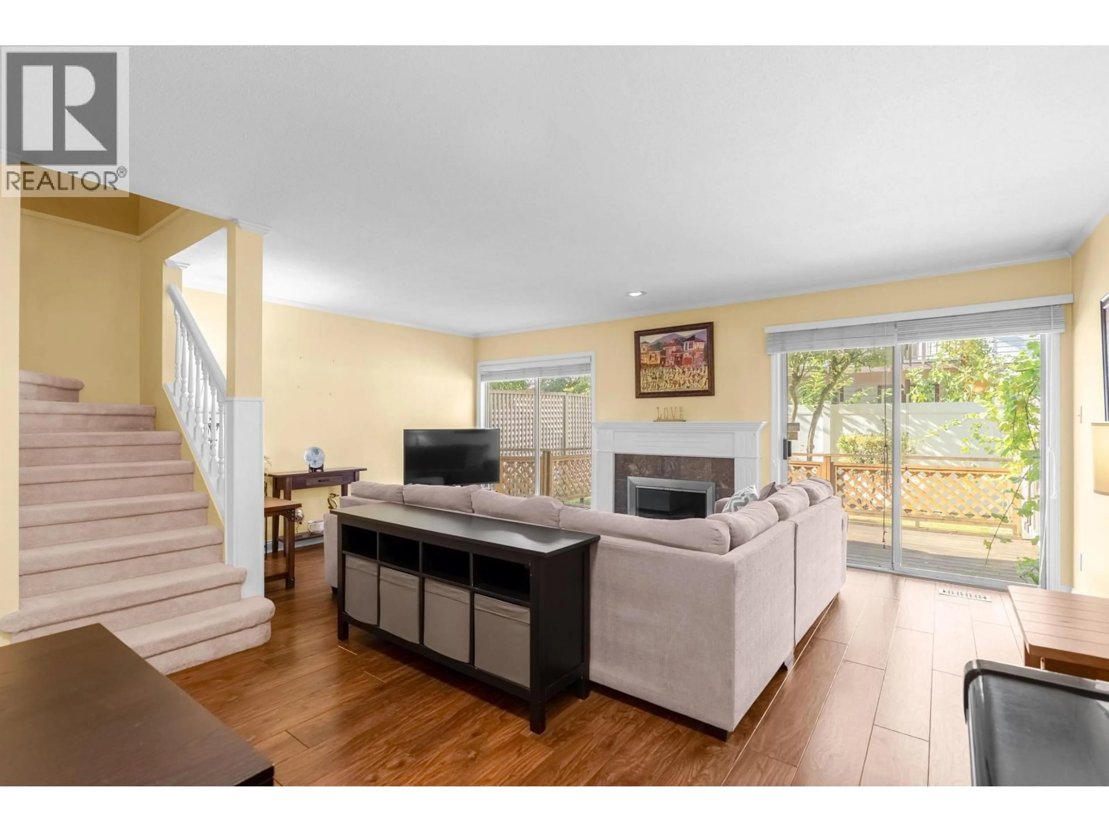 Living room with furniture, wood/laminate floor for 13 - 7820 ABERCROMBIE PLACE, Richmond British Columbia V6Y3M2