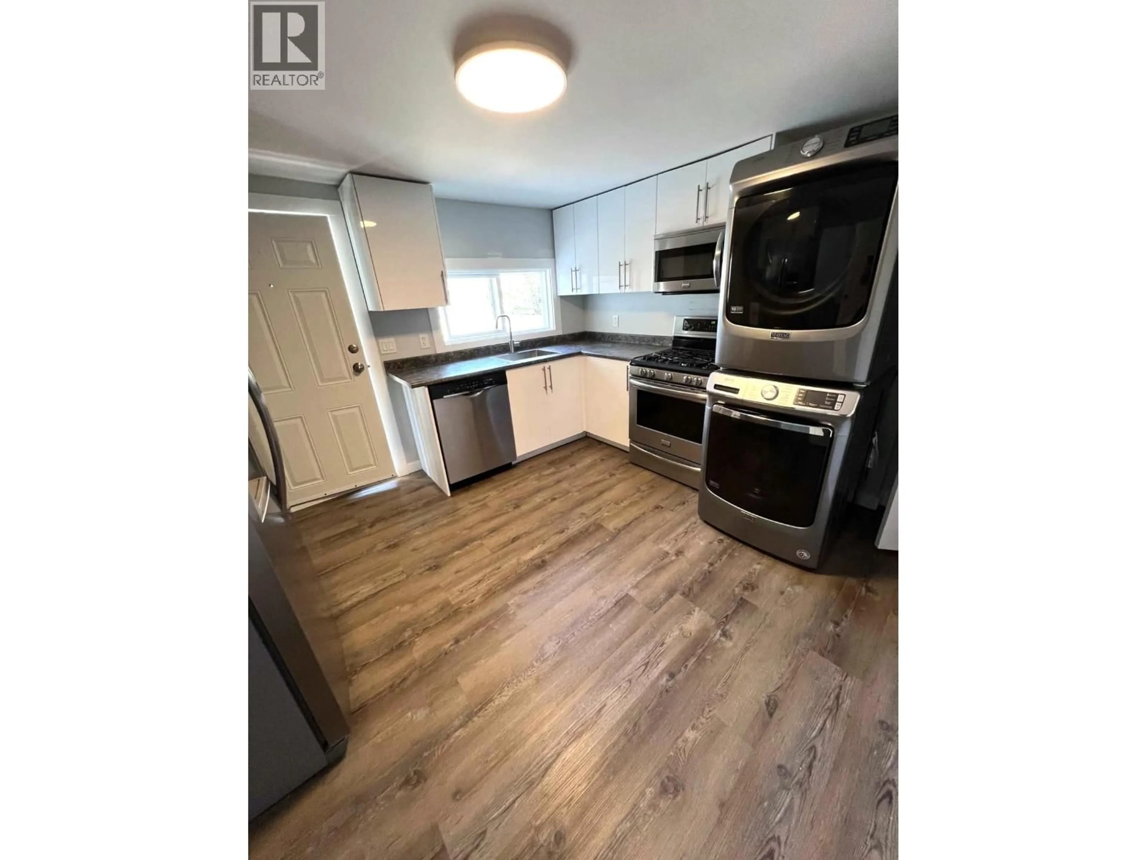 Open concept kitchen, wood/laminate floor for 1355 LA SALLE AVENUE, Prince George British Columbia V2L4K1