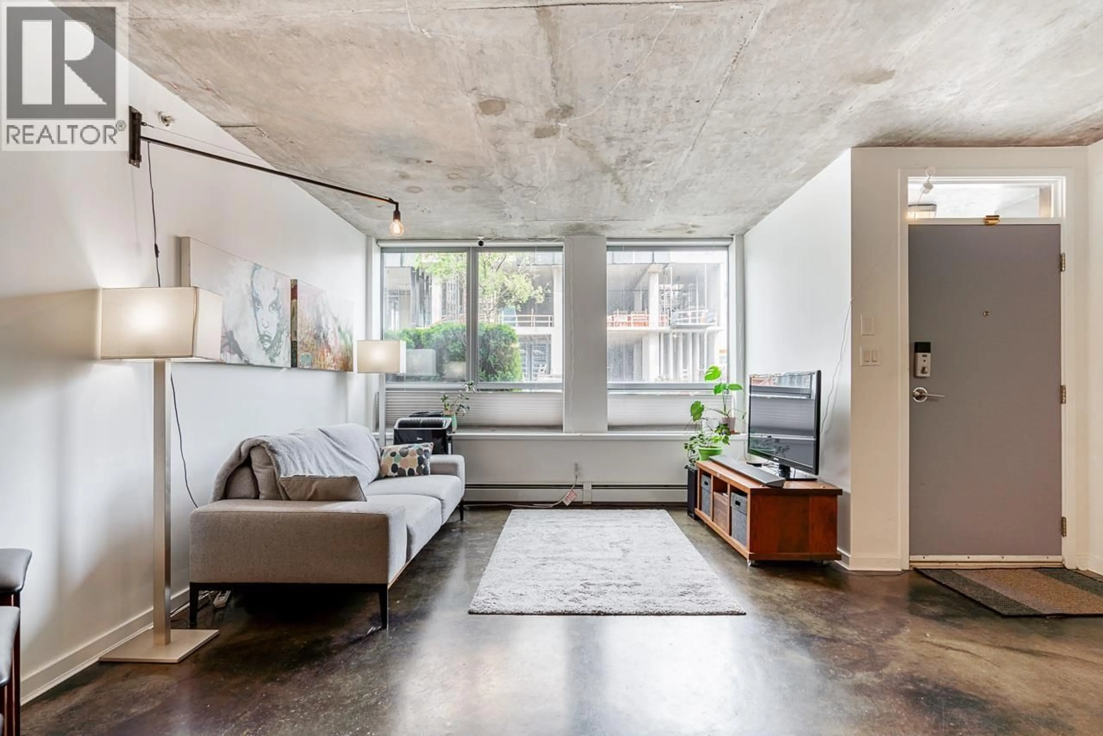 Living room with furniture, cement floor for 917 STATION STREET, Vancouver British Columbia V6A4J8