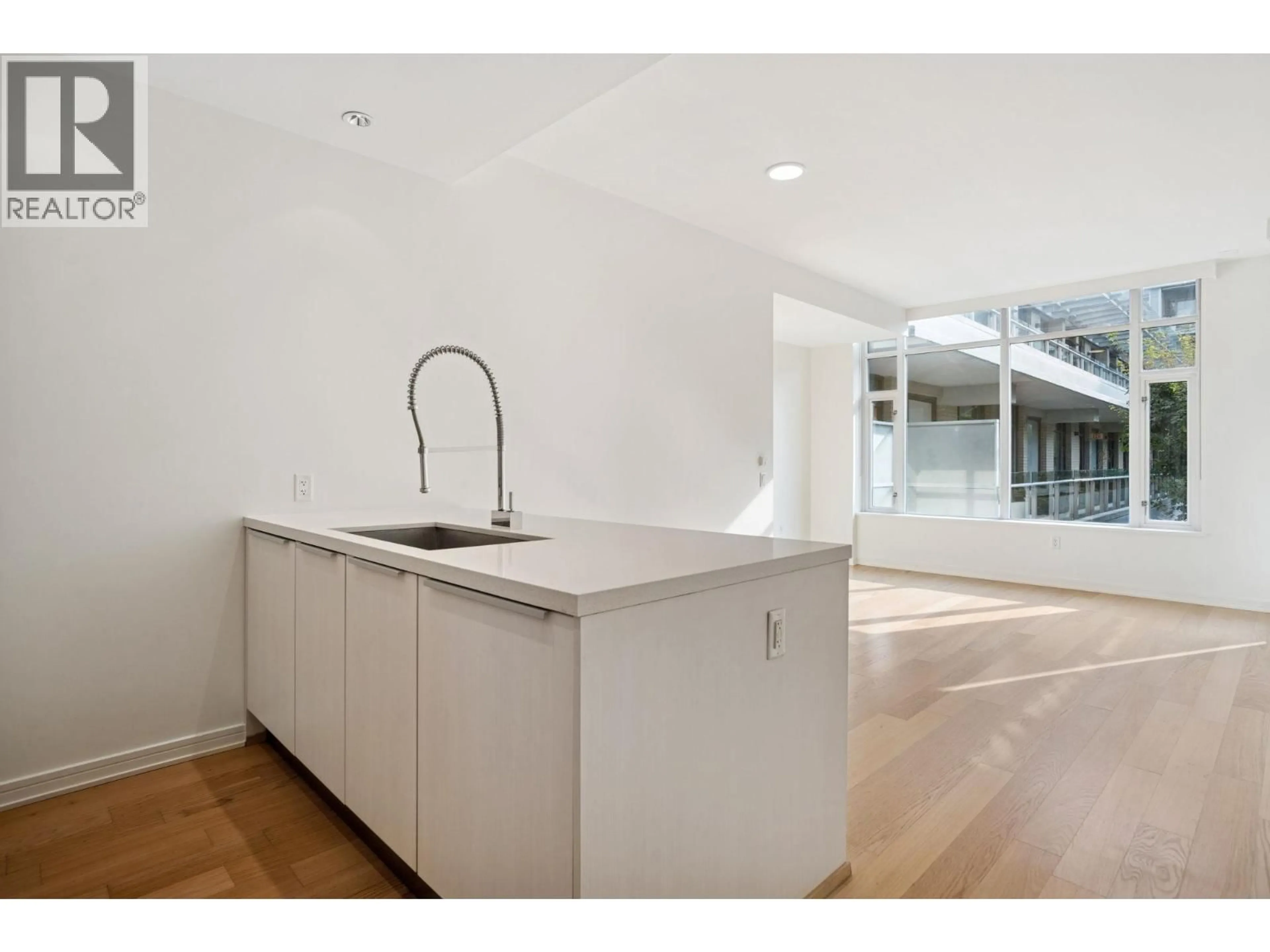 Open concept kitchen, unknown for 407 - 77 WALTER HARDWICK AVENUE, Vancouver British Columbia V5Y0C6