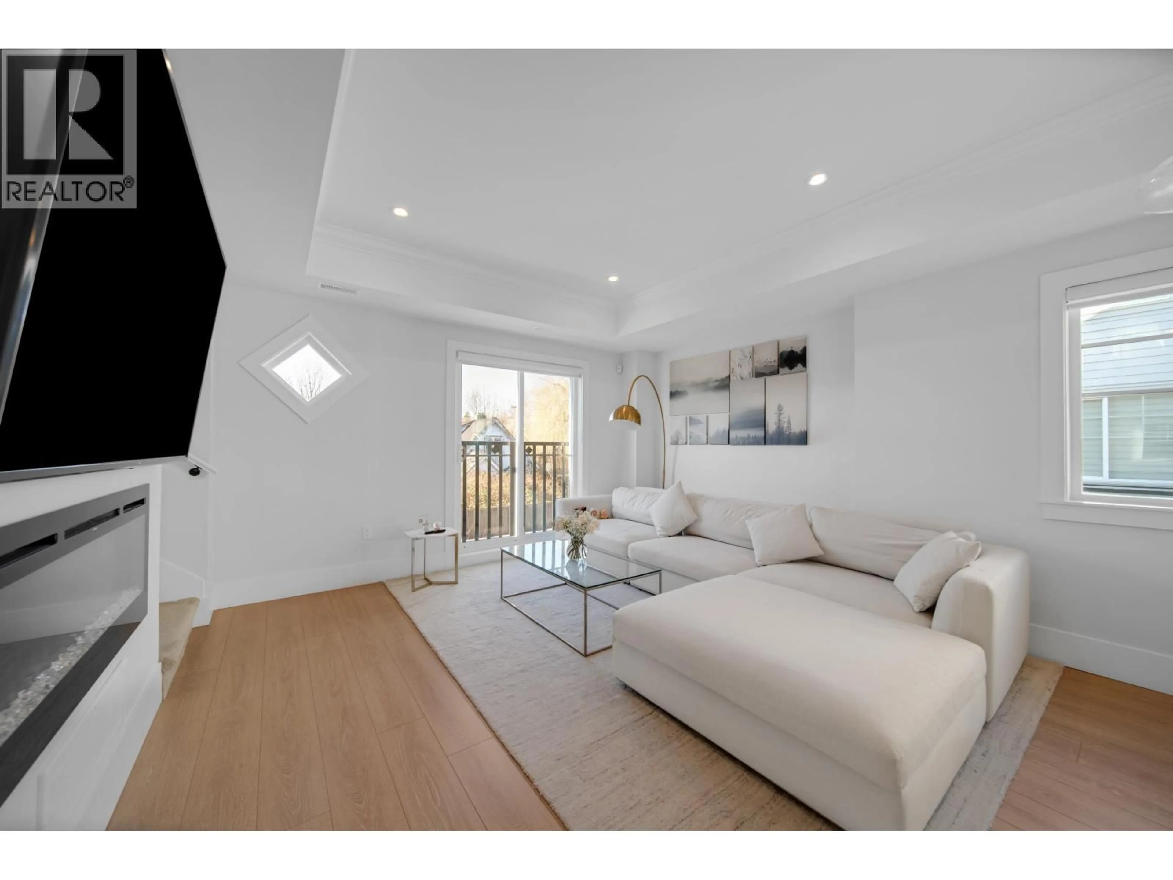 Living room with furniture, wood/laminate floor for 24 - 9211 MCKIM WAY, Richmond British Columbia V6X0T1