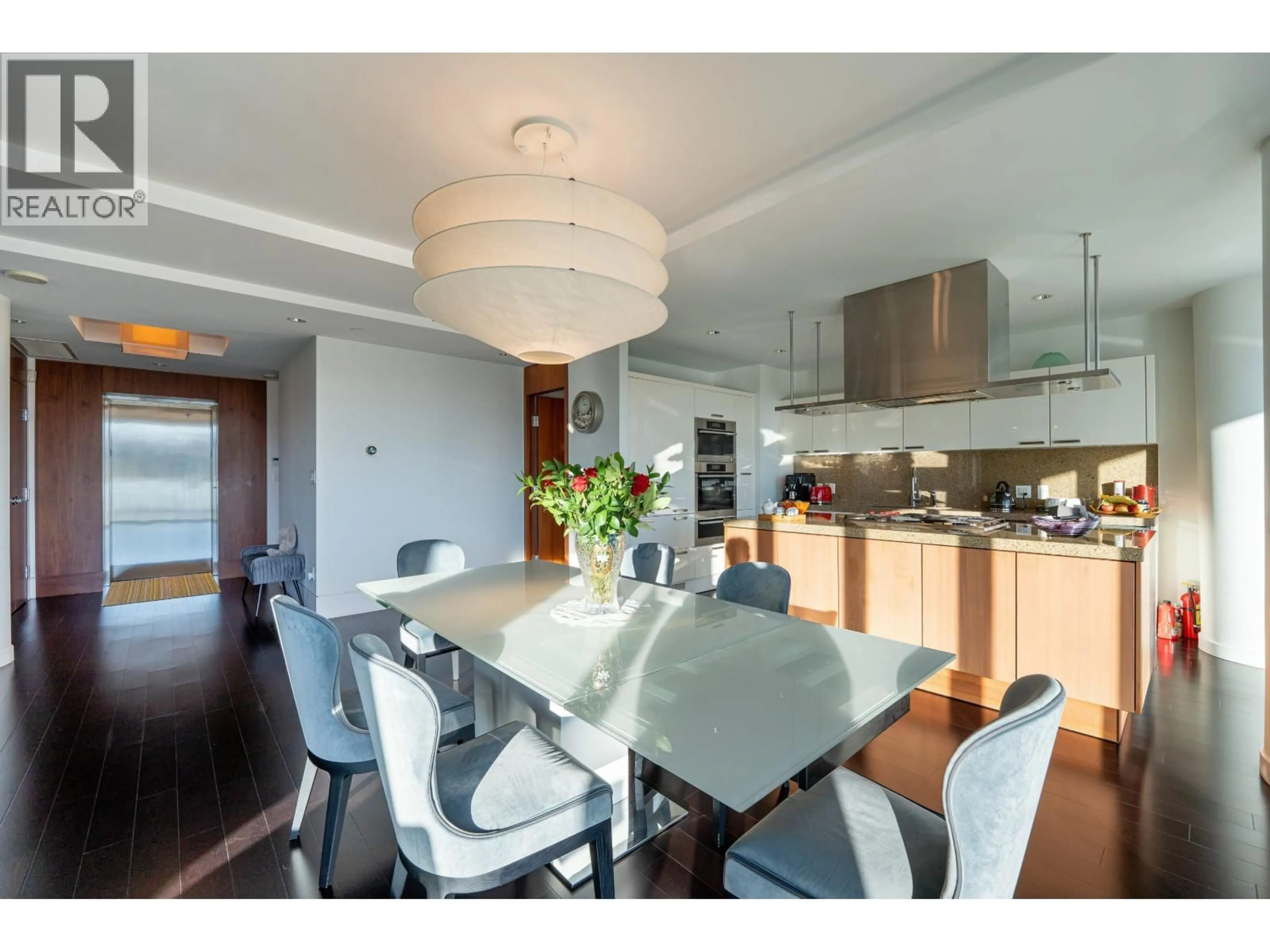 Open concept kitchen, wood/laminate floor for 306 - 1560 HOMER MEWS, Vancouver British Columbia V6Z0A5