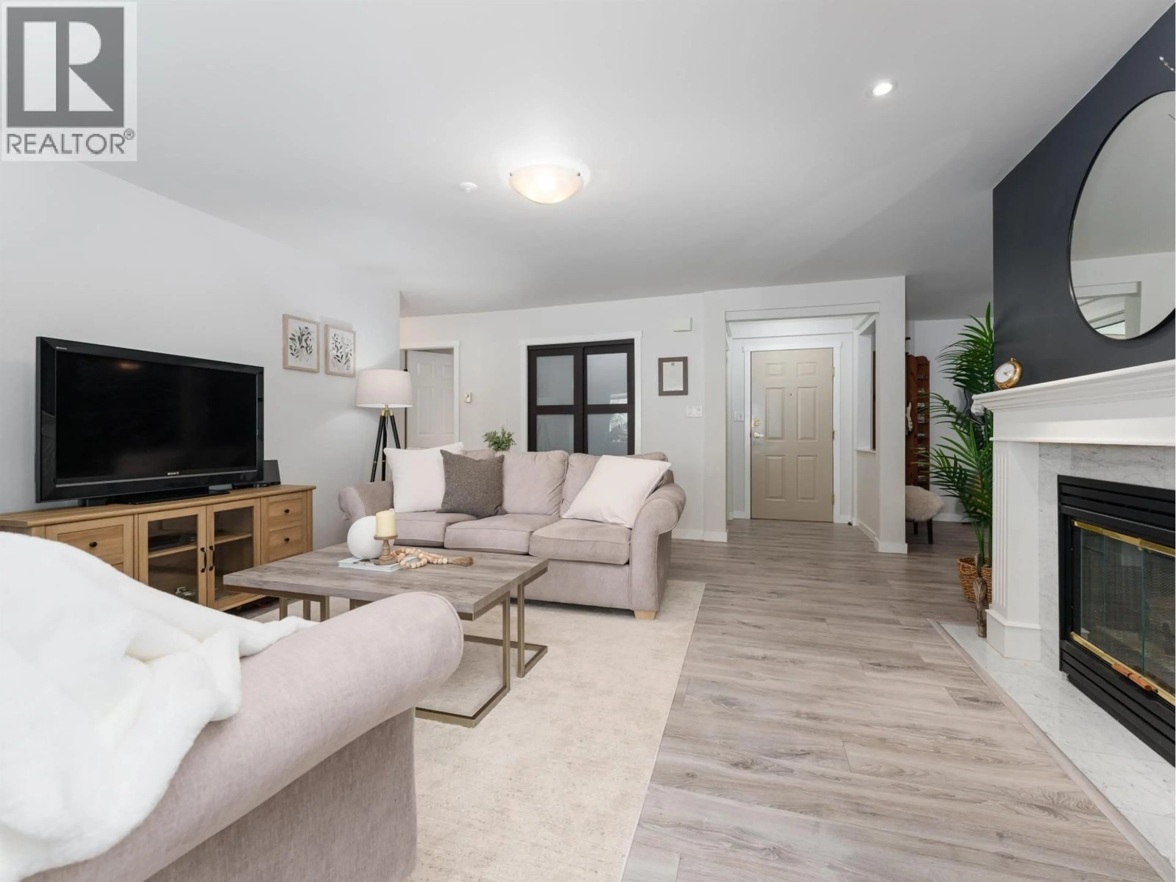 Living room with furniture, unknown for 212 - 3690 BANFF COURT, North Vancouver British Columbia V7H2Y7