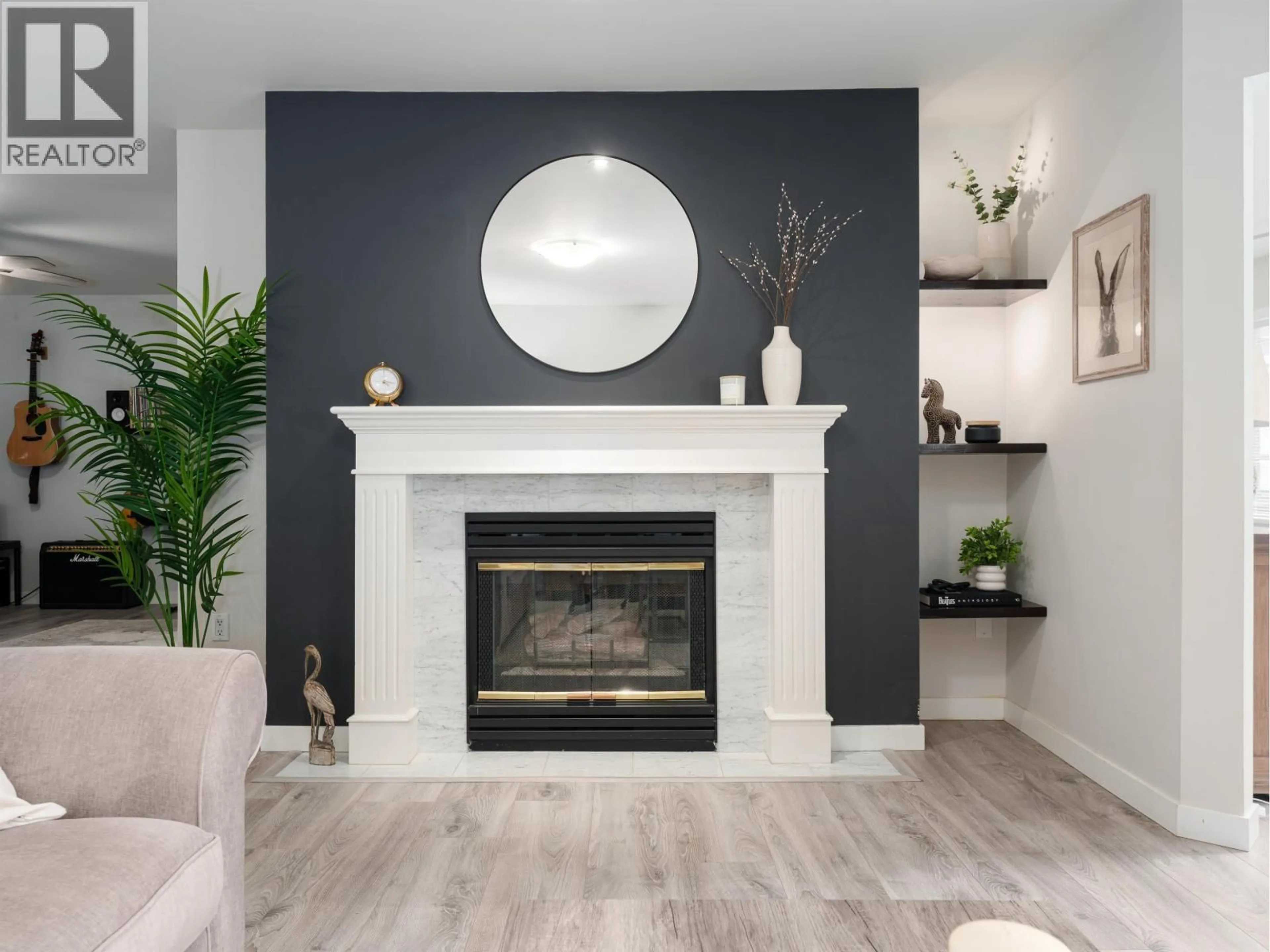 Living room with furniture, wood/laminate floor for 212 - 3690 BANFF COURT, North Vancouver British Columbia V7H2Y7