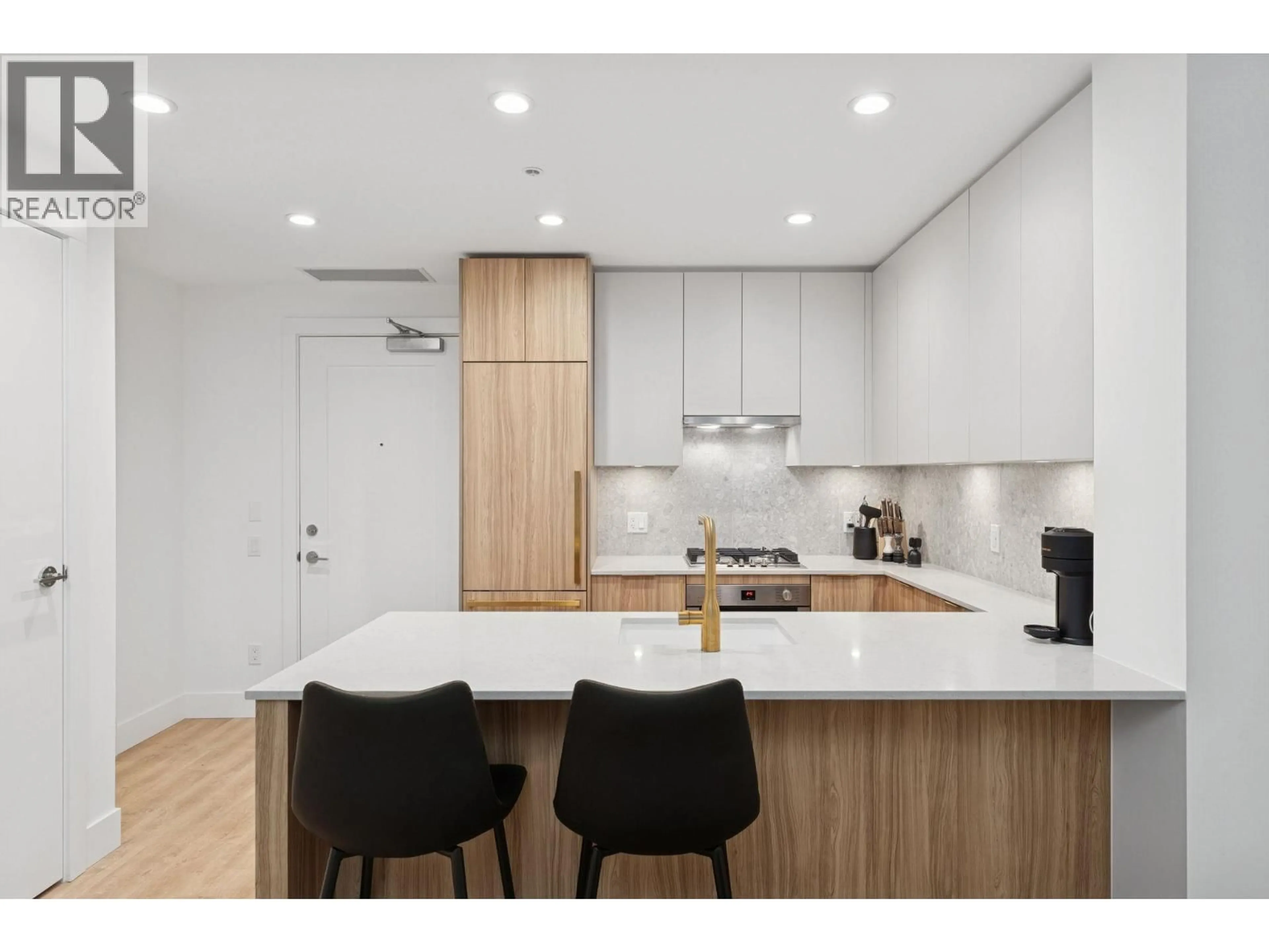 Open concept kitchen, wood/laminate floor for 208 - 2375 EMERY COURT, North Vancouver British Columbia V7J0E8