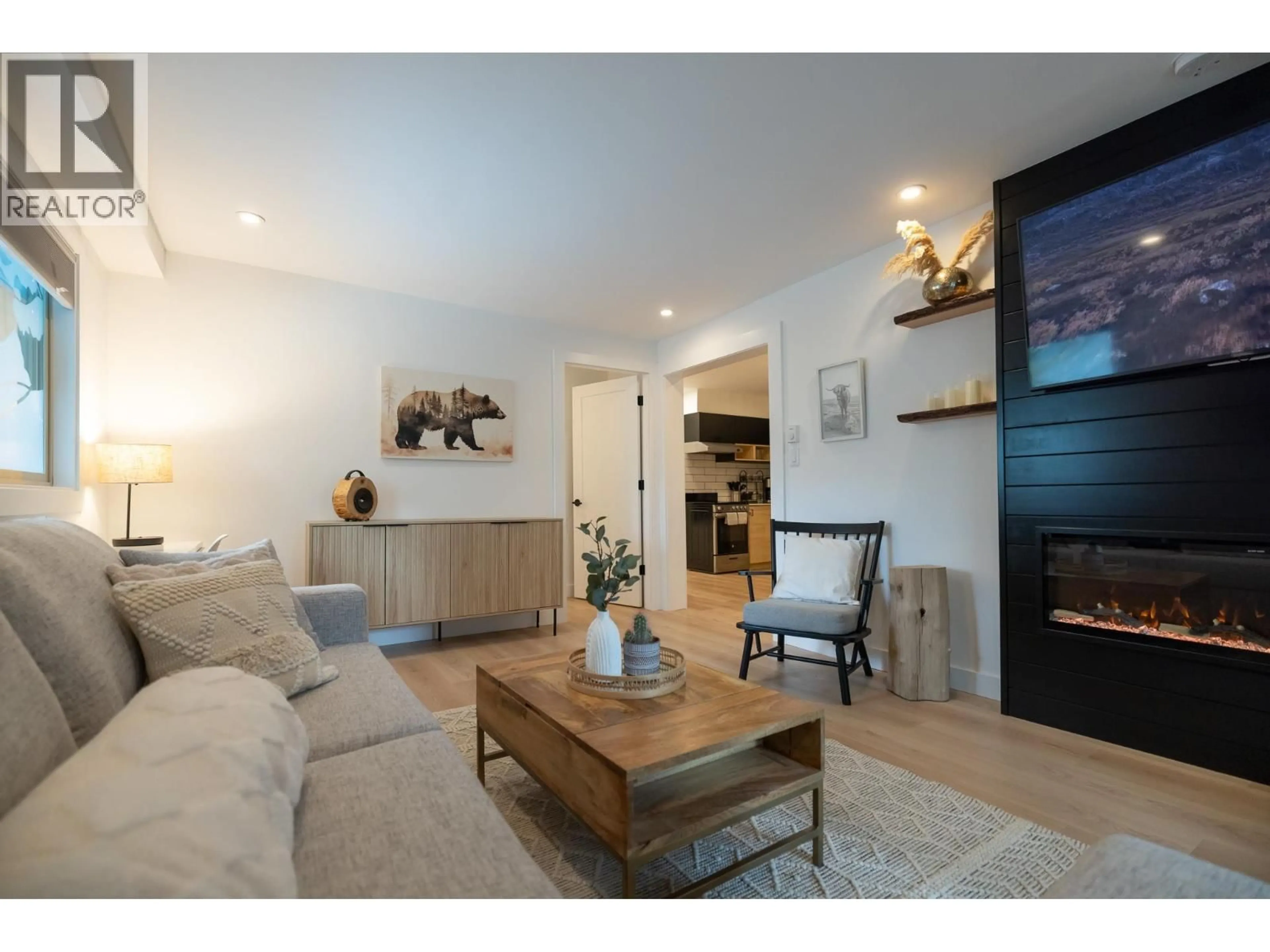 Living room with furniture, wood/laminate floor for 100 - 2021 KAREN CRESCENT, Whistler British Columbia V8E0H1