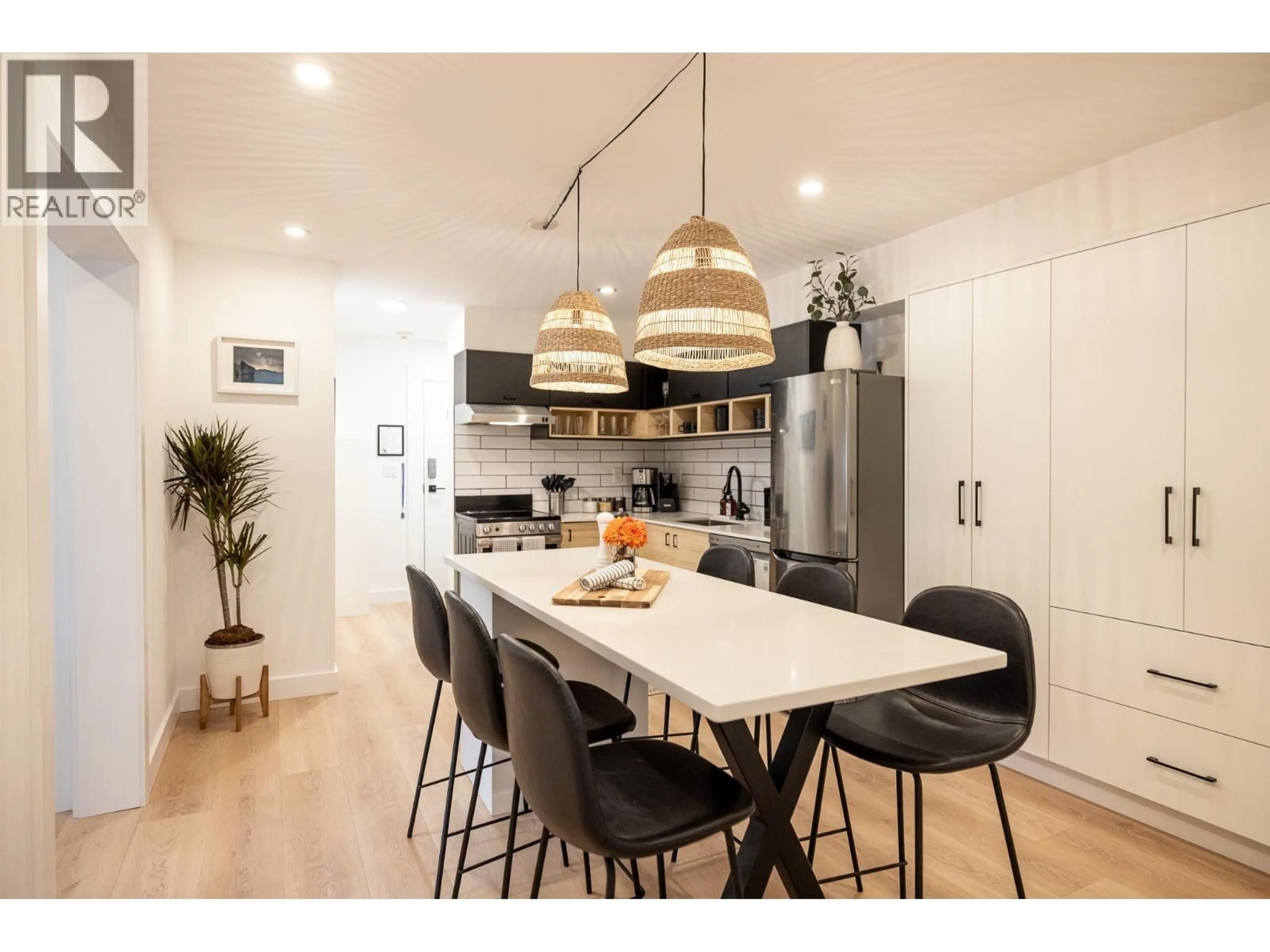 Open concept kitchen, wood/laminate floor for 100 - 2021 KAREN CRESCENT, Whistler British Columbia V8E0H1