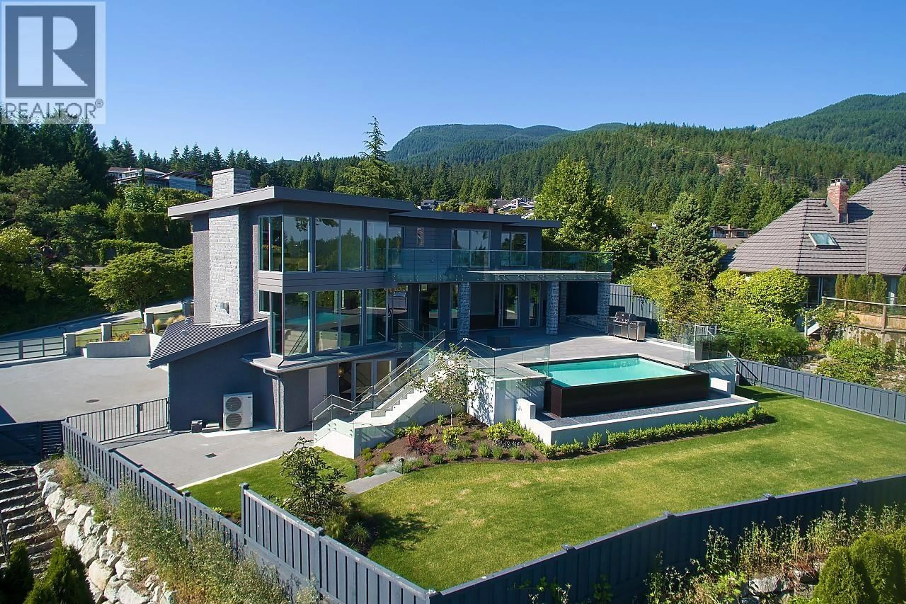 A pic from outside/outdoor area/front of a property/back of a property/a pic from drone, mountain view for 4265 ROCKBANK PLACE, West Vancouver British Columbia V7W1A8