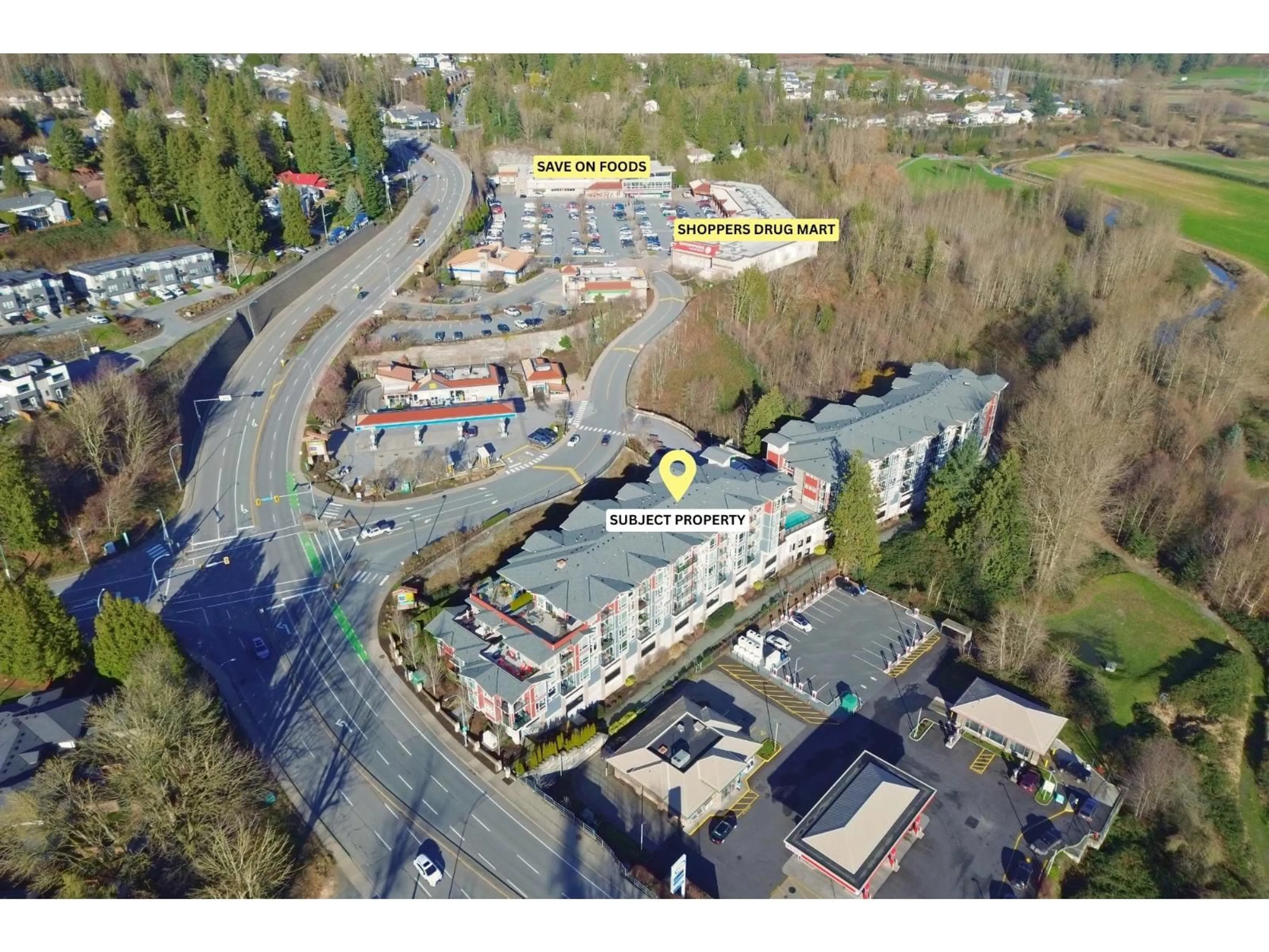 A pic from outside/outdoor area/front of a property/back of a property/a pic from drone, street for 203 - 2242 WHATCOM ROAD, Abbotsford British Columbia V3G0B3