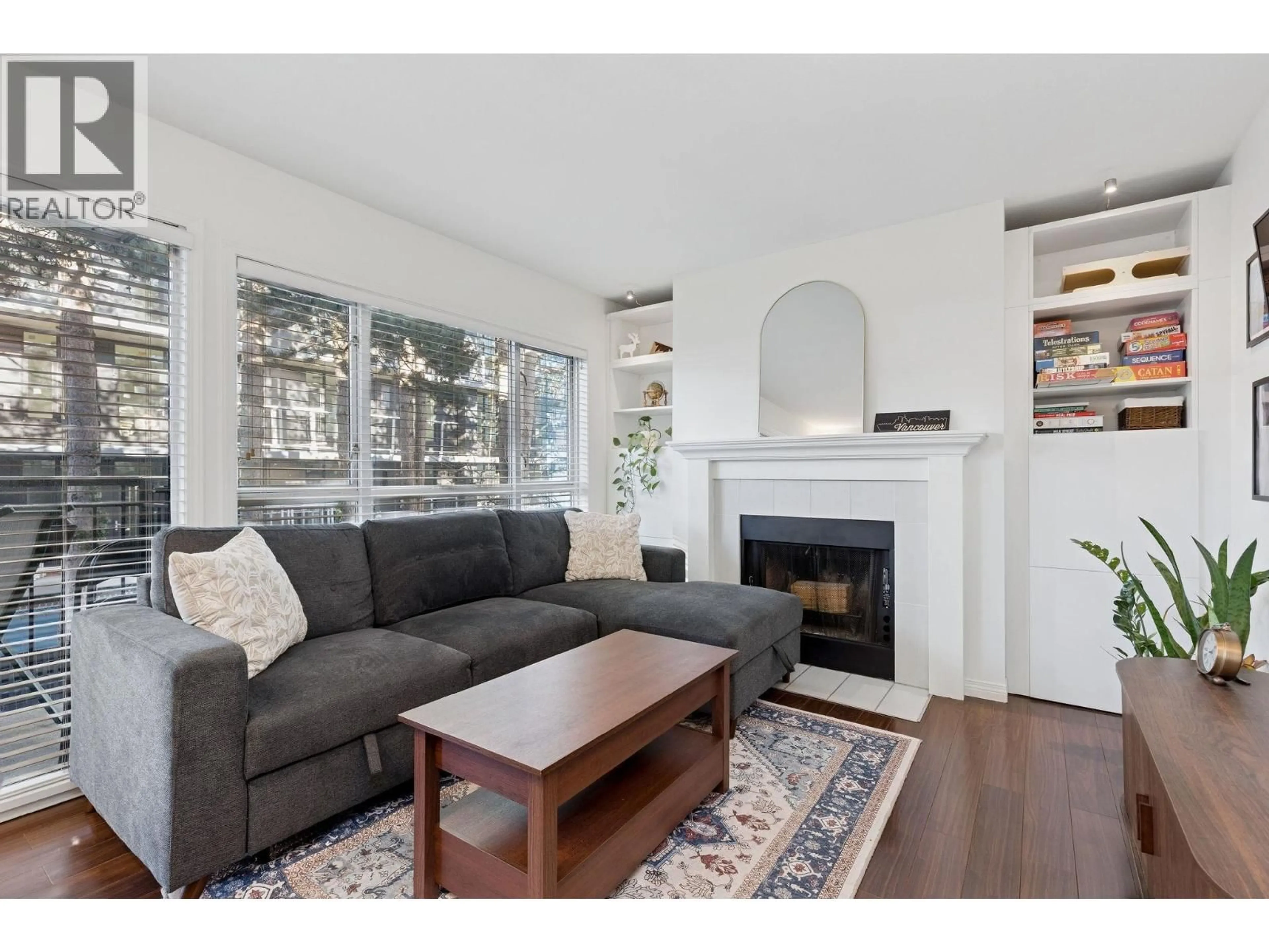 Living room with furniture, wood/laminate floor for 203 - 555 14TH AVENUE, Vancouver British Columbia V5Z4G8