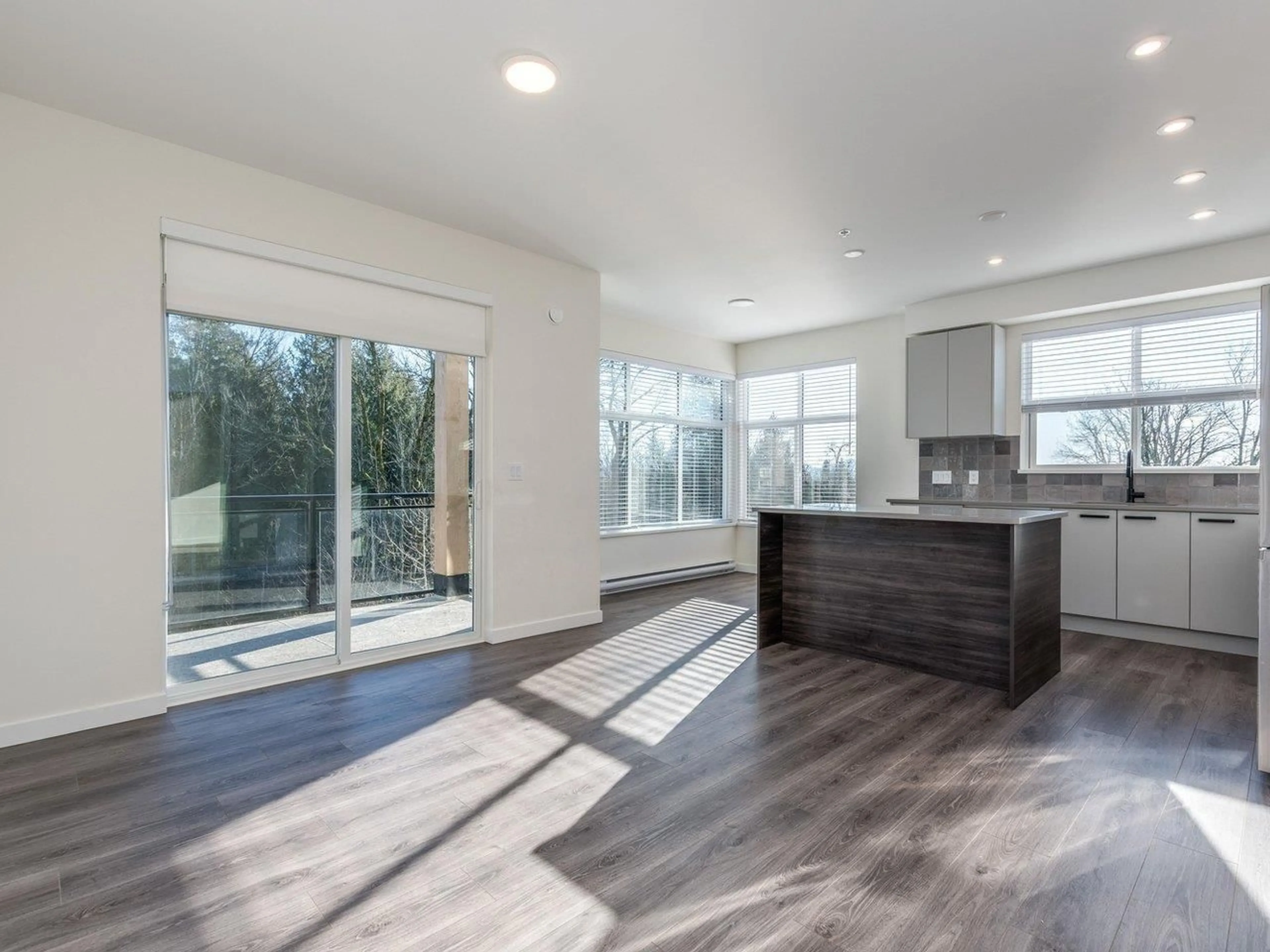 Open concept kitchen, wood/laminate floor for 311 - 33920 BEST AVENUE, Mission British Columbia V2V0L9