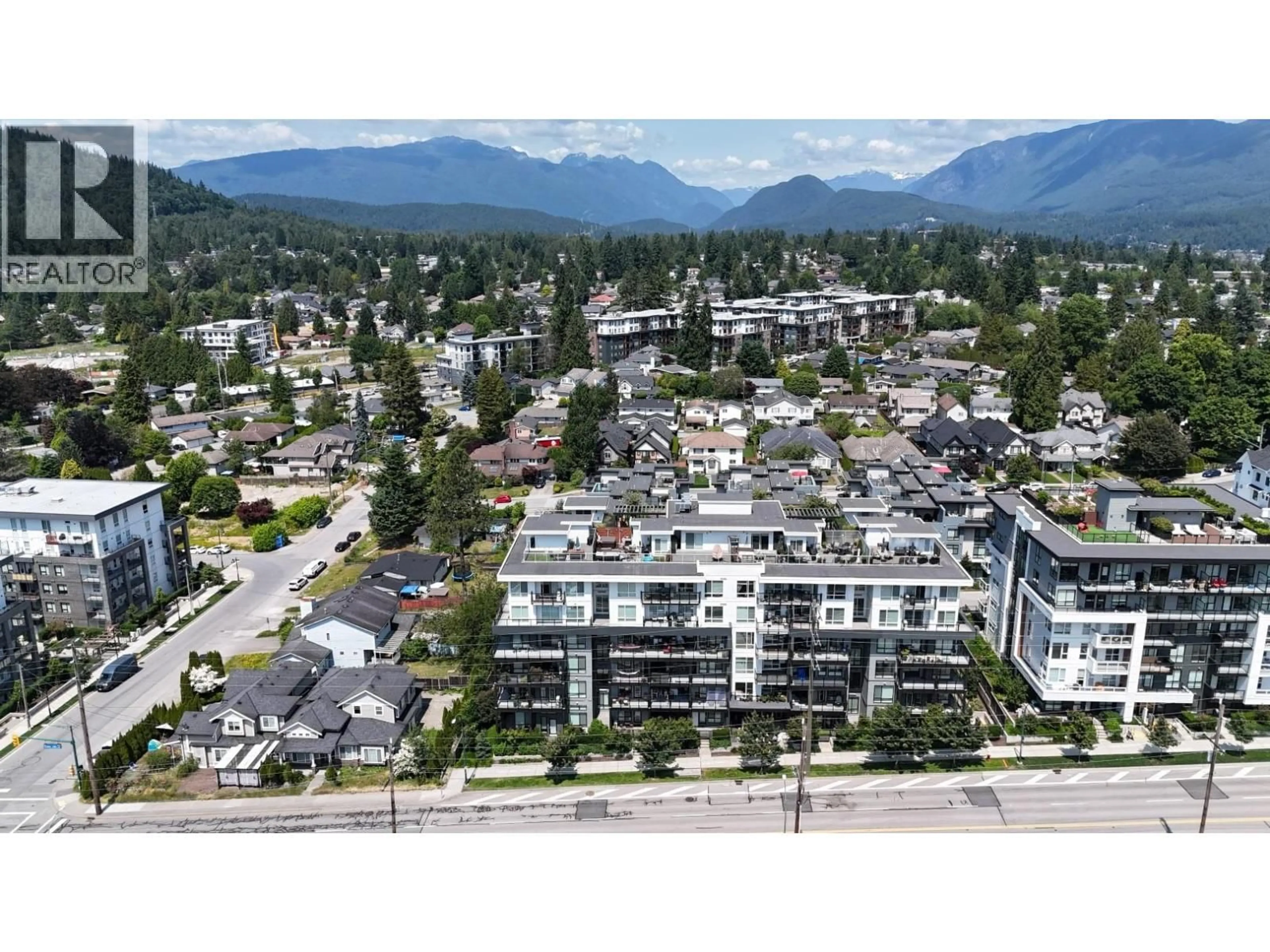 A pic from outside/outdoor area/front of a property/back of a property/a pic from drone, mountain view for 311 - 707 COMO LAKE AVENUE, Coquitlam British Columbia V3J0J5