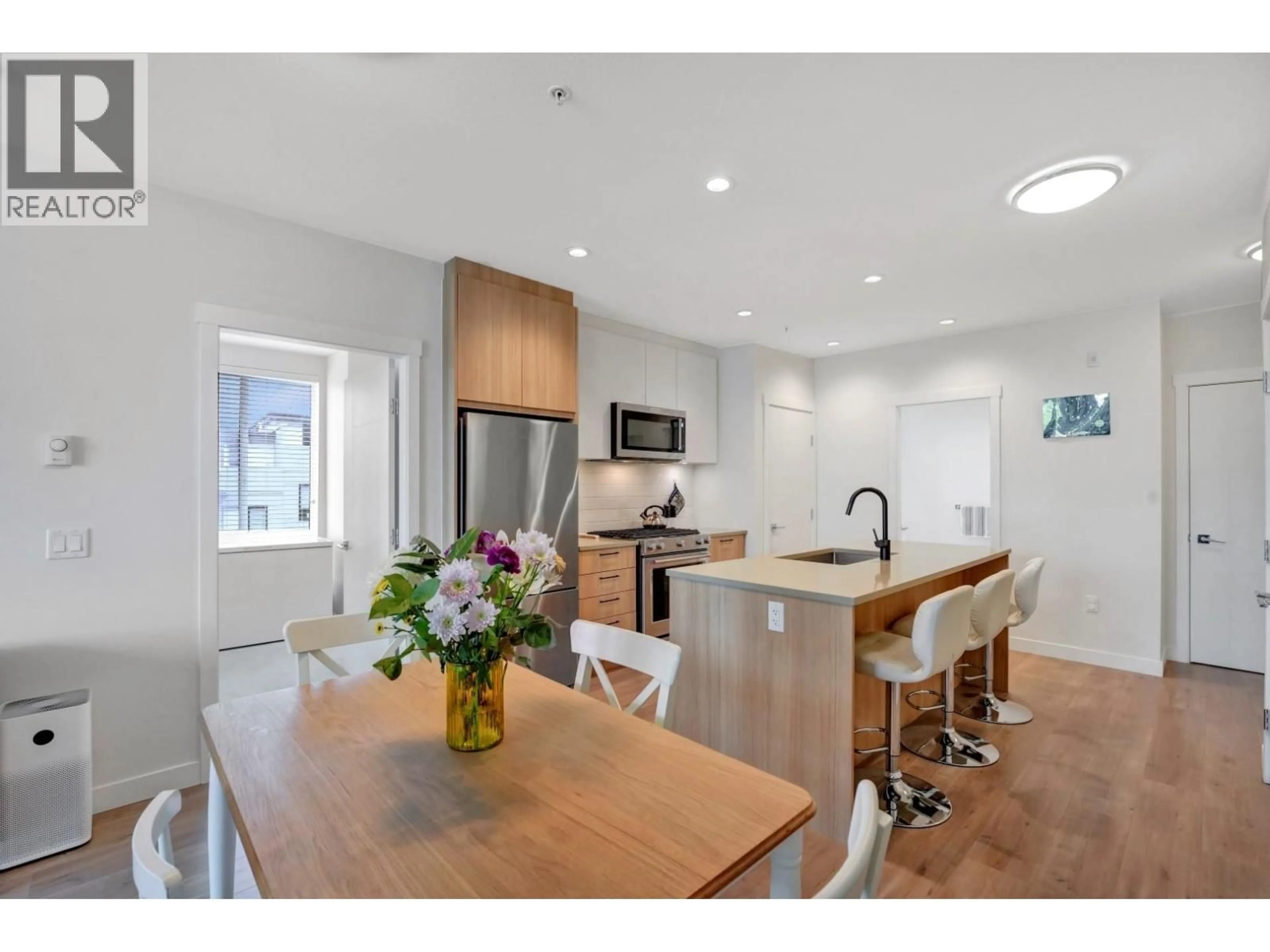 Open concept kitchen, wood/laminate floor for 311 - 707 COMO LAKE AVENUE, Coquitlam British Columbia V3J0J5