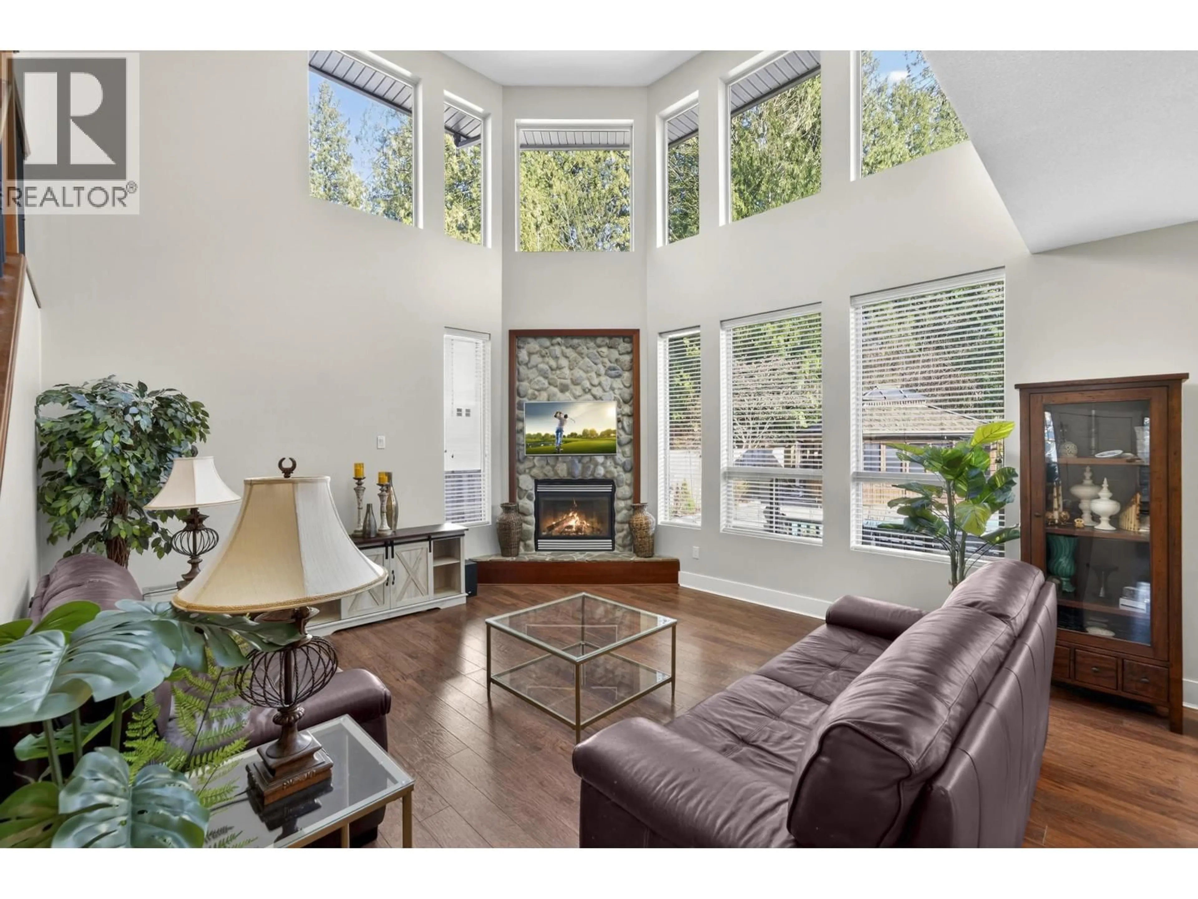 Living room with furniture, wood/laminate floor for 10668 245B STREET, Maple Ridge British Columbia V2W2G2