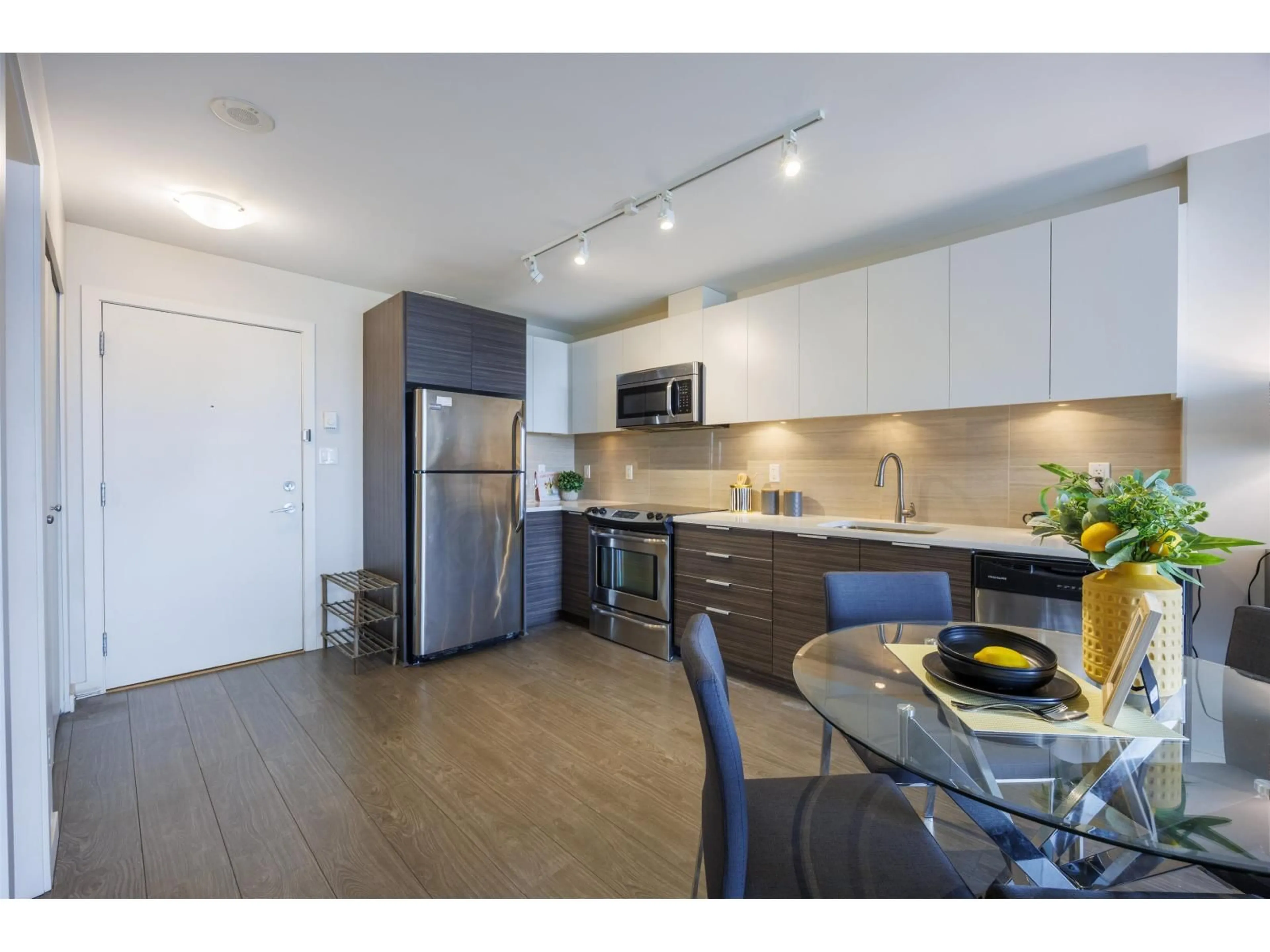 Open concept kitchen, wood/laminate floor for 2202 - 13303 CENTRAL AVENUE, Surrey British Columbia V3T0K6