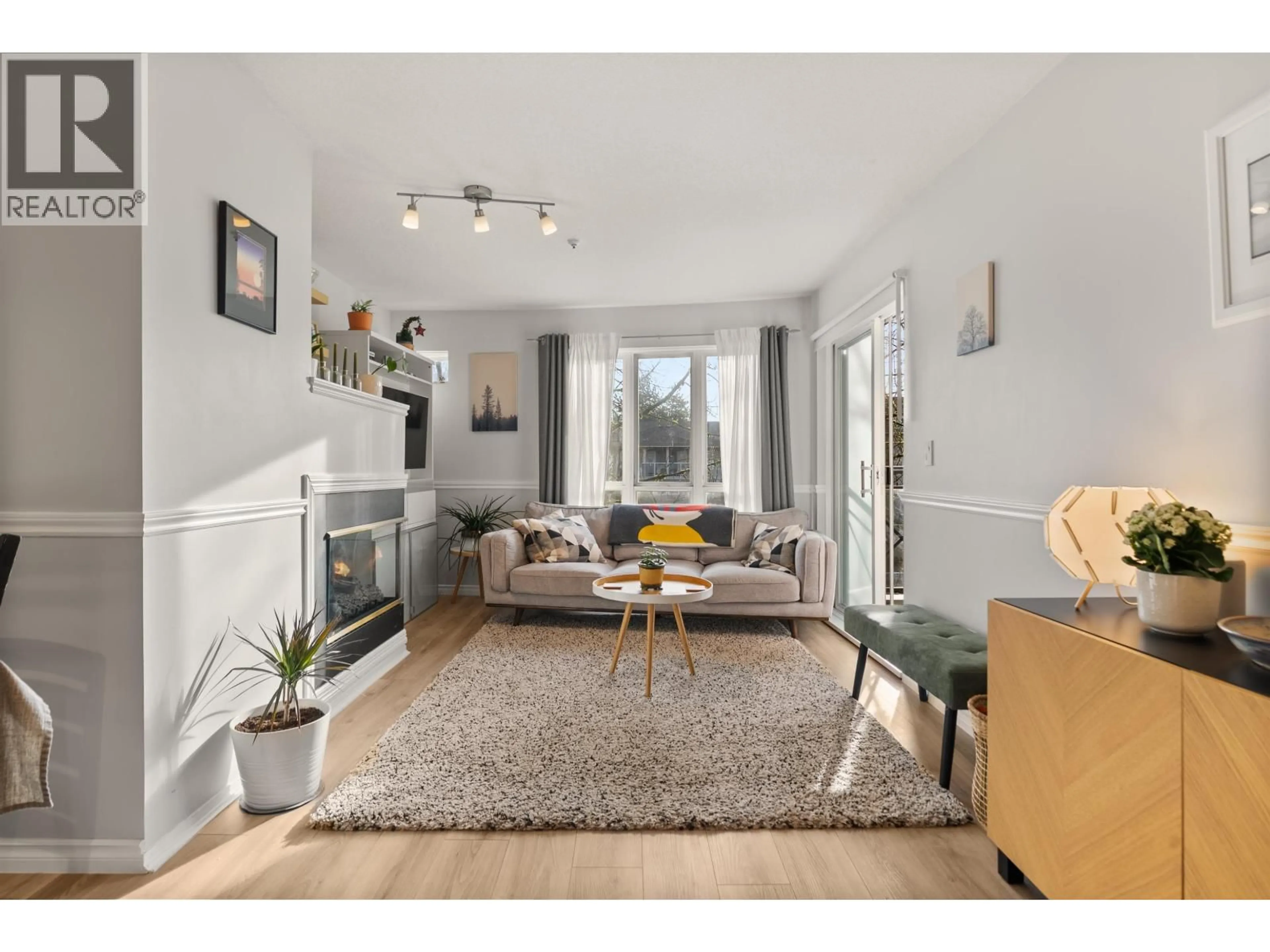 Living room with furniture, wood/laminate floor for 308 - 2435 WELCHER AVENUE, Port Coquitlam British Columbia V3C1X8