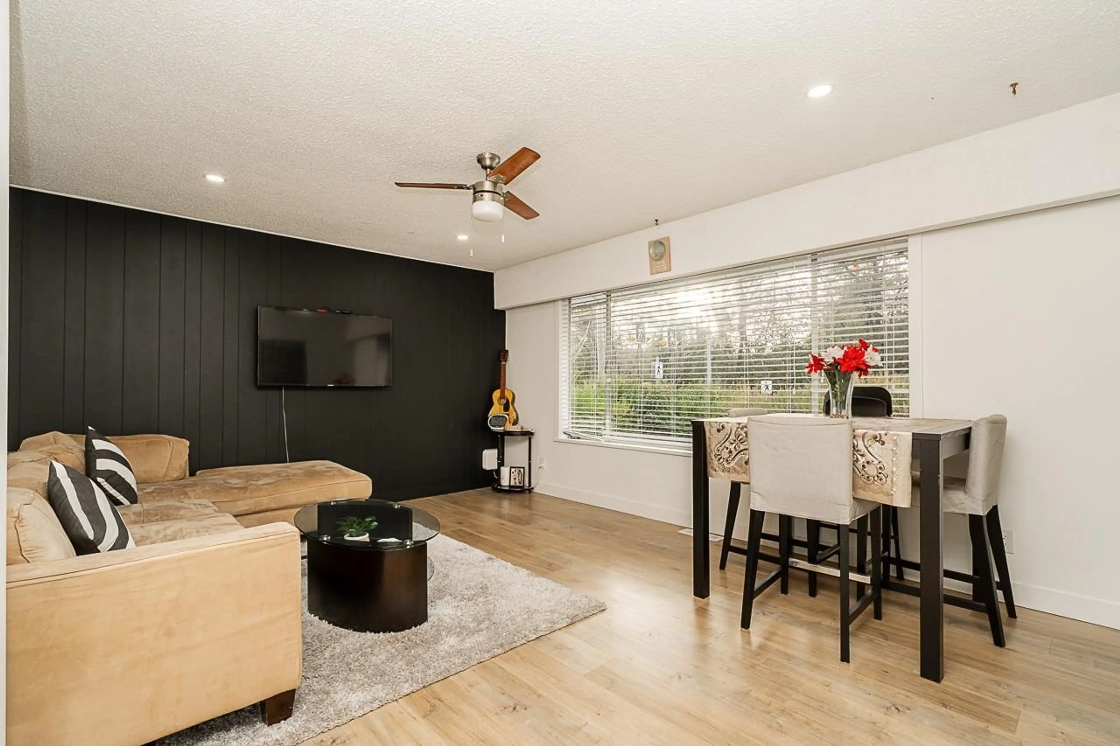 Living room with furniture, wood/laminate floor for 11205 78A AVENUE, Delta British Columbia V4C1P4