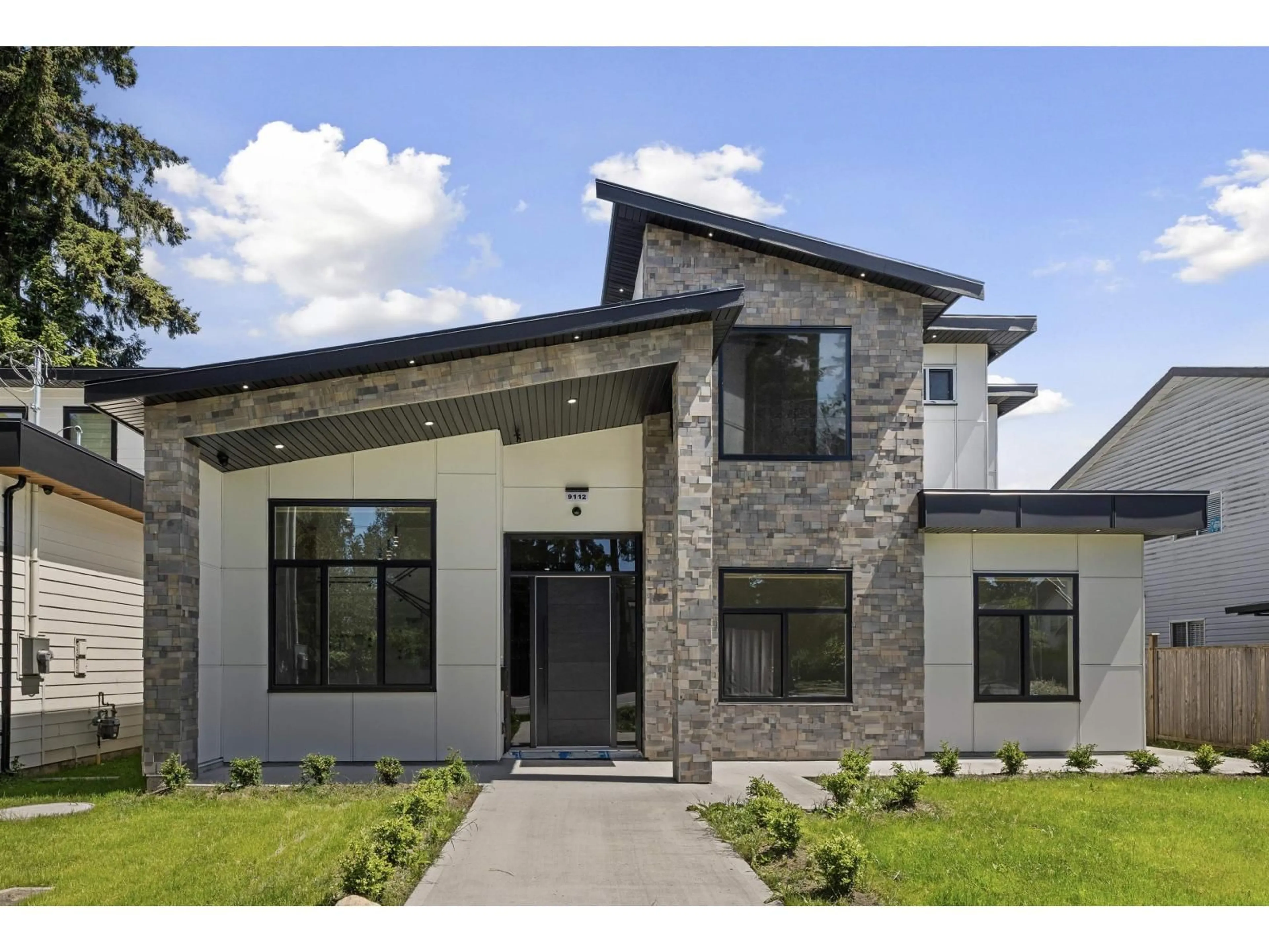 Home with brick exterior material, unknown for 9112 156 STREET, Surrey British Columbia V3R5Y8