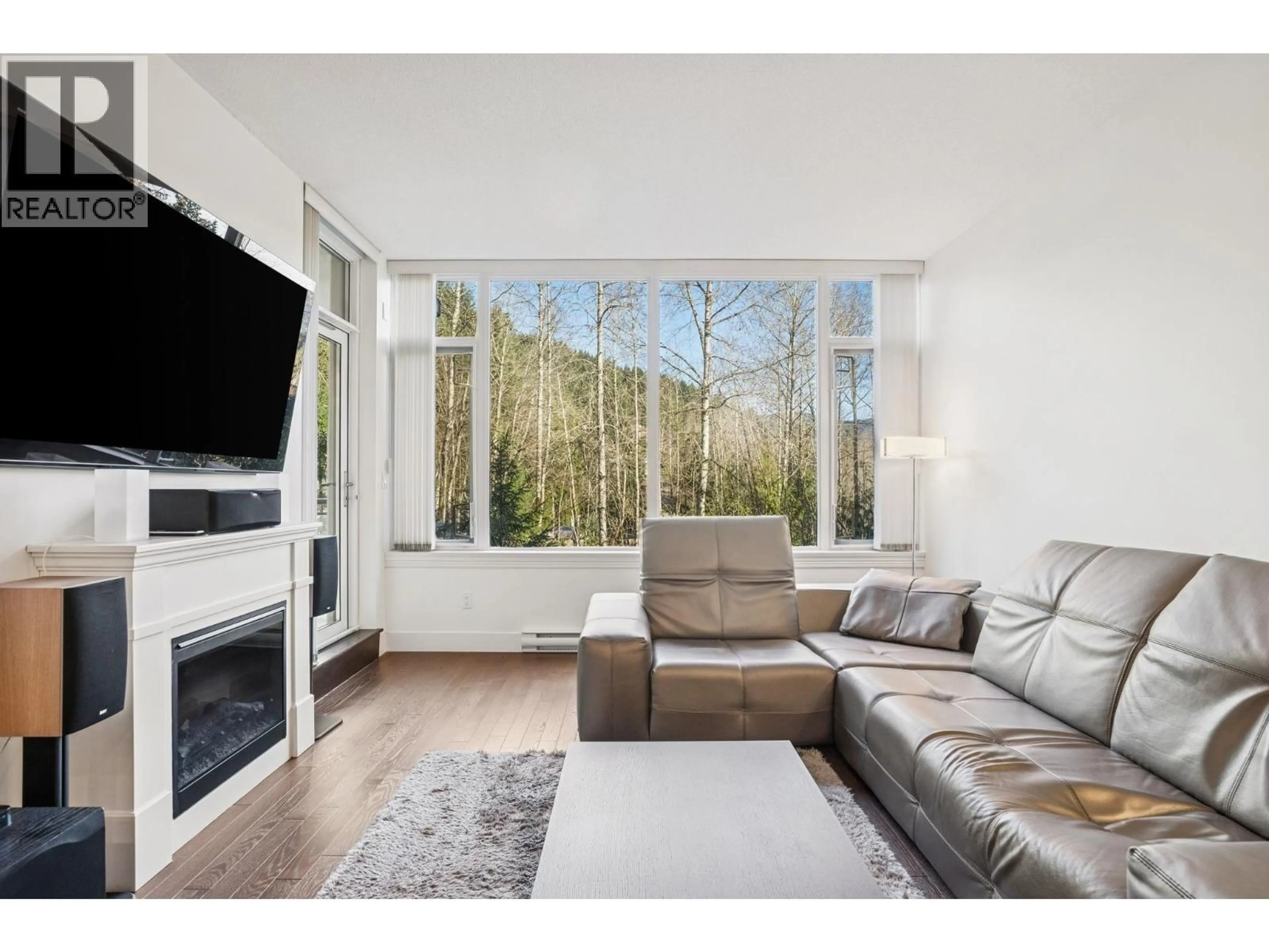 Living room with furniture, wood/laminate floor for 707 - 1415 PARKWAY BOULEVARD, Coquitlam British Columbia V3E0C7