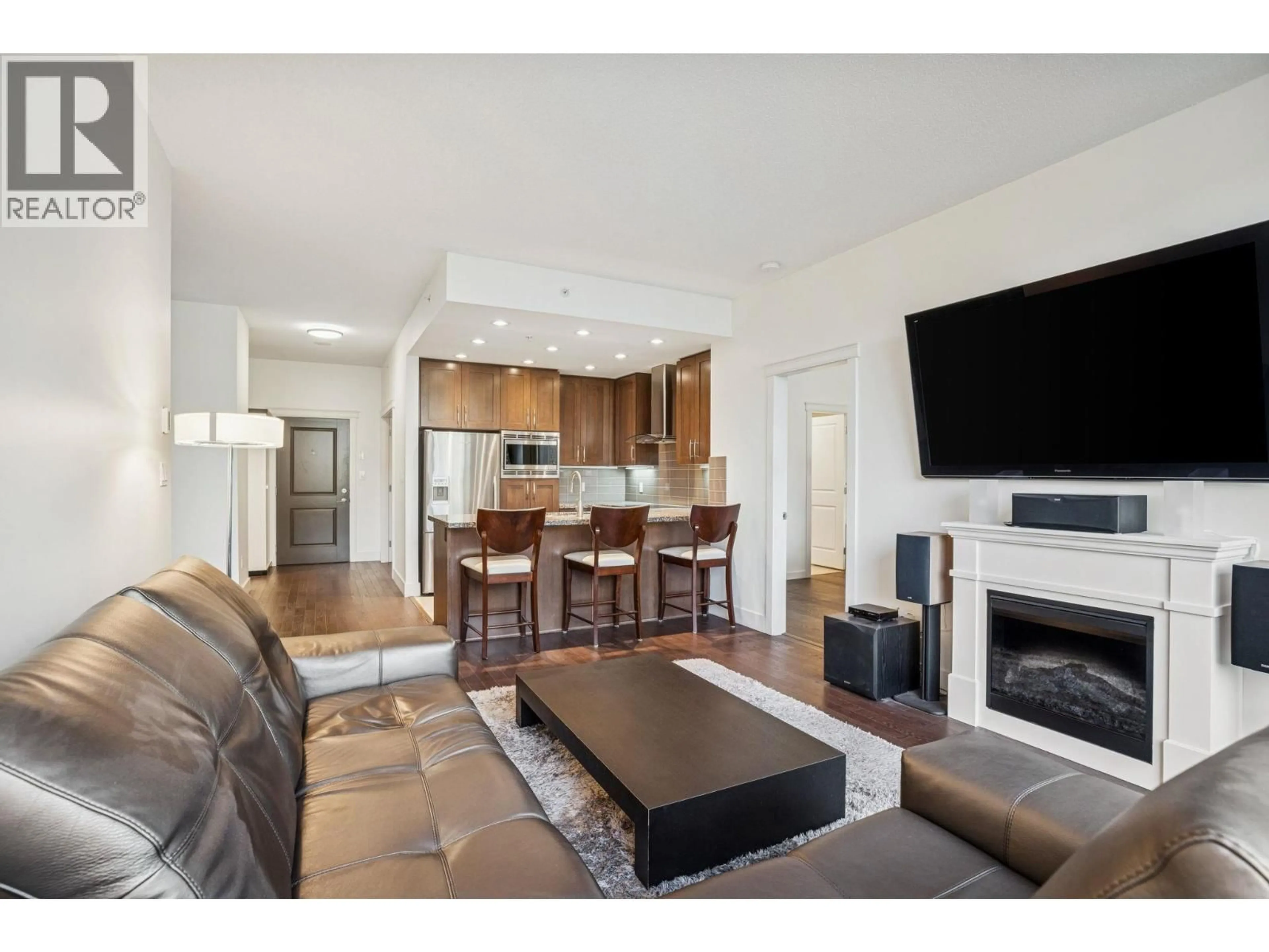 Living room with furniture, wood/laminate floor for 707 - 1415 PARKWAY BOULEVARD, Coquitlam British Columbia V3E0C7