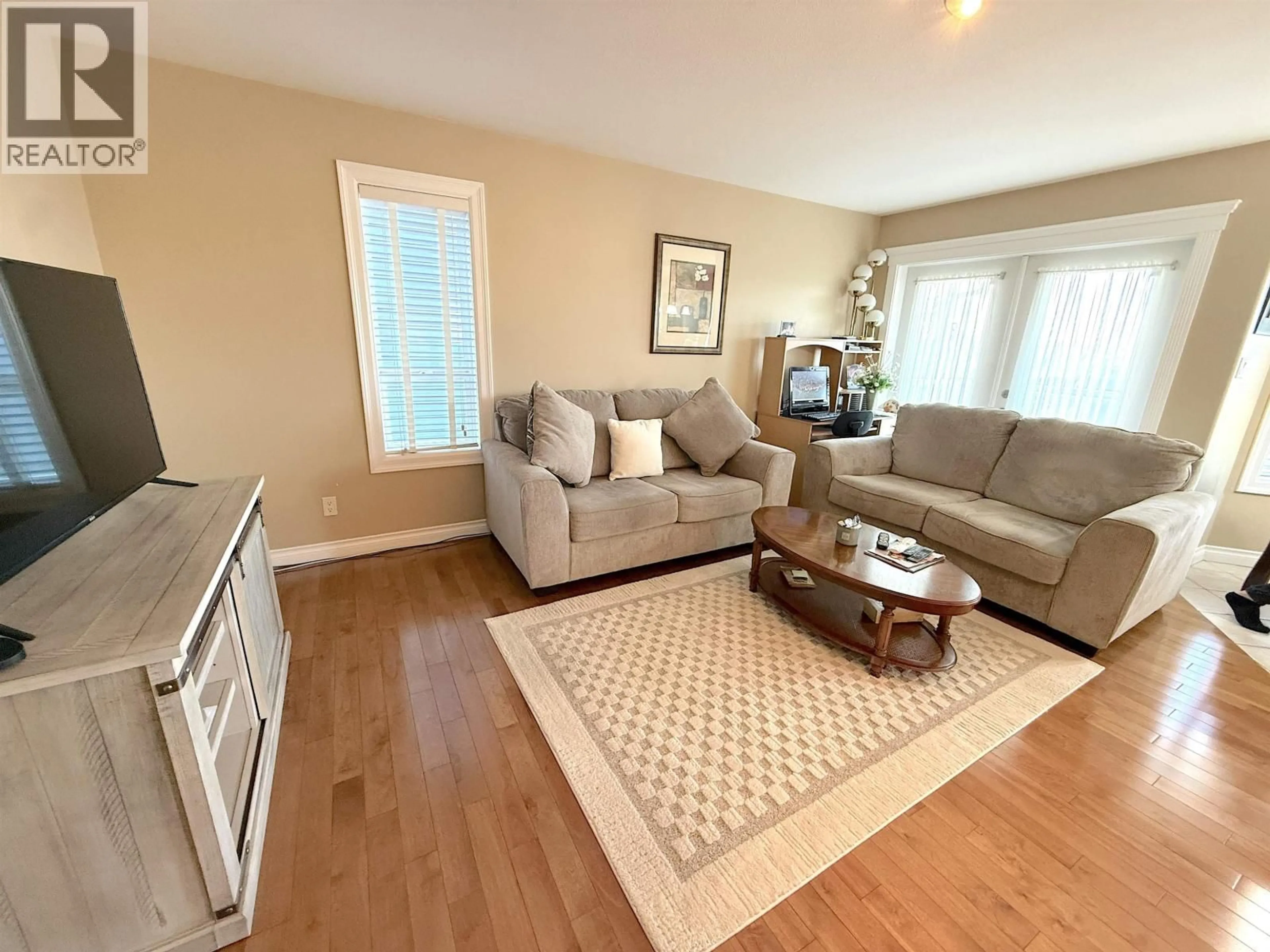 Living room with furniture, wood/laminate floor for 1041 EAGLE DRIVE, Prince Rupert British Columbia V8J4R4