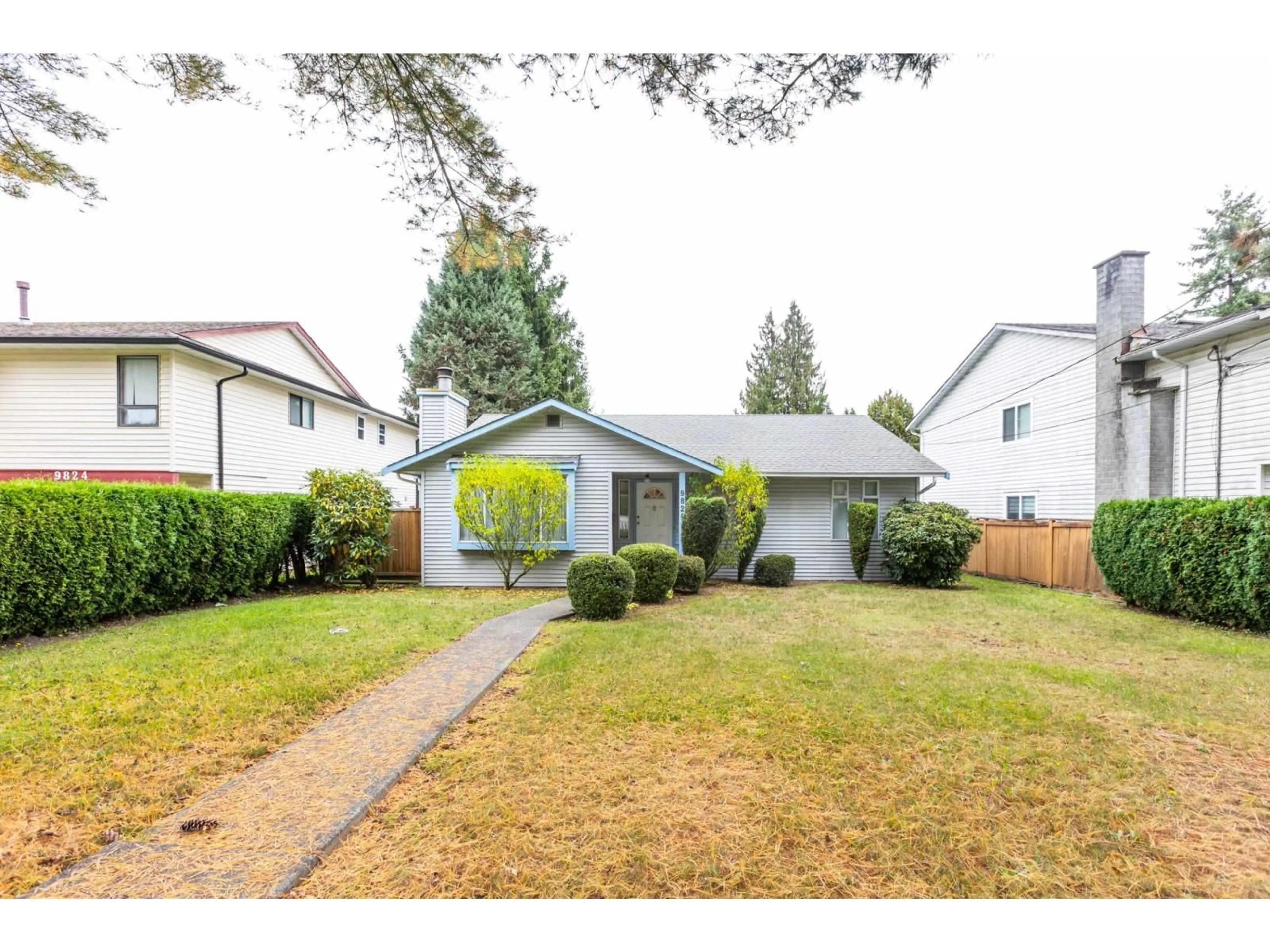 Home with vinyl exterior material, street for 9820 156 STREET, Surrey British Columbia V3R4L3