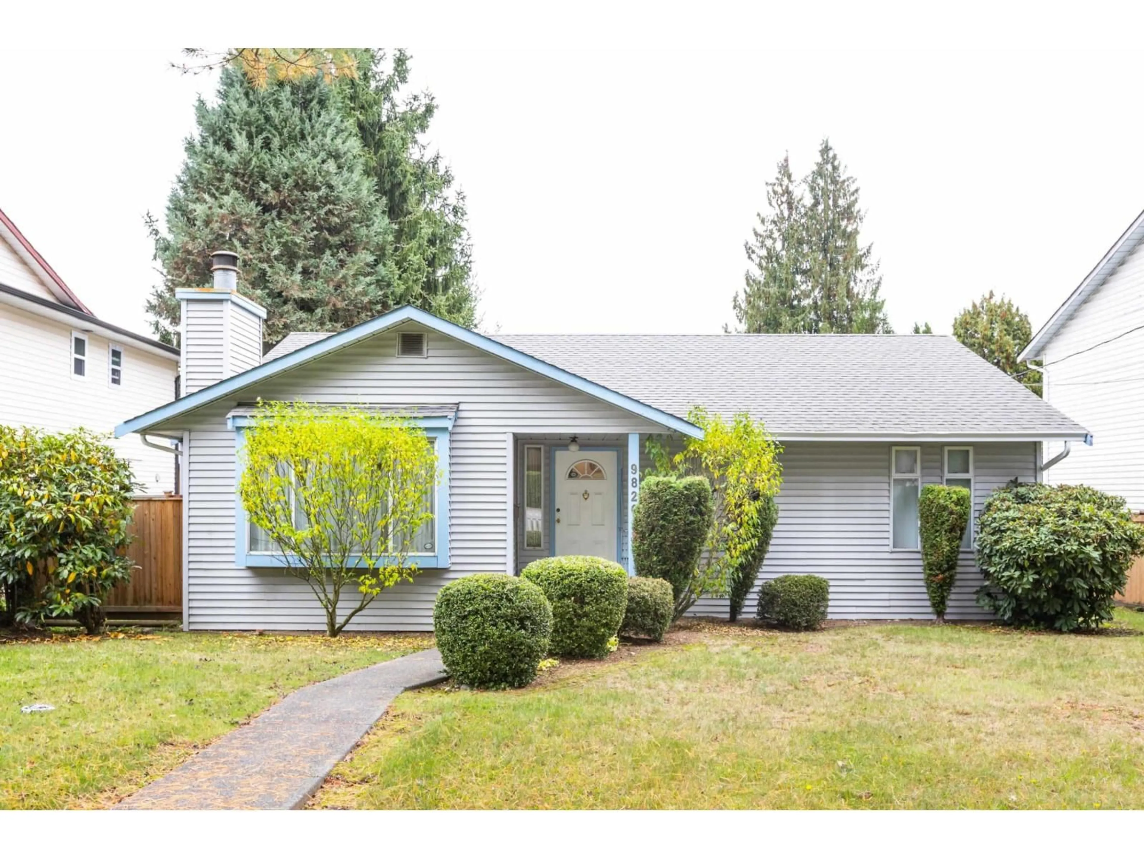 Home with vinyl exterior material, street for 9820 156 STREET, Surrey British Columbia V3R4L3