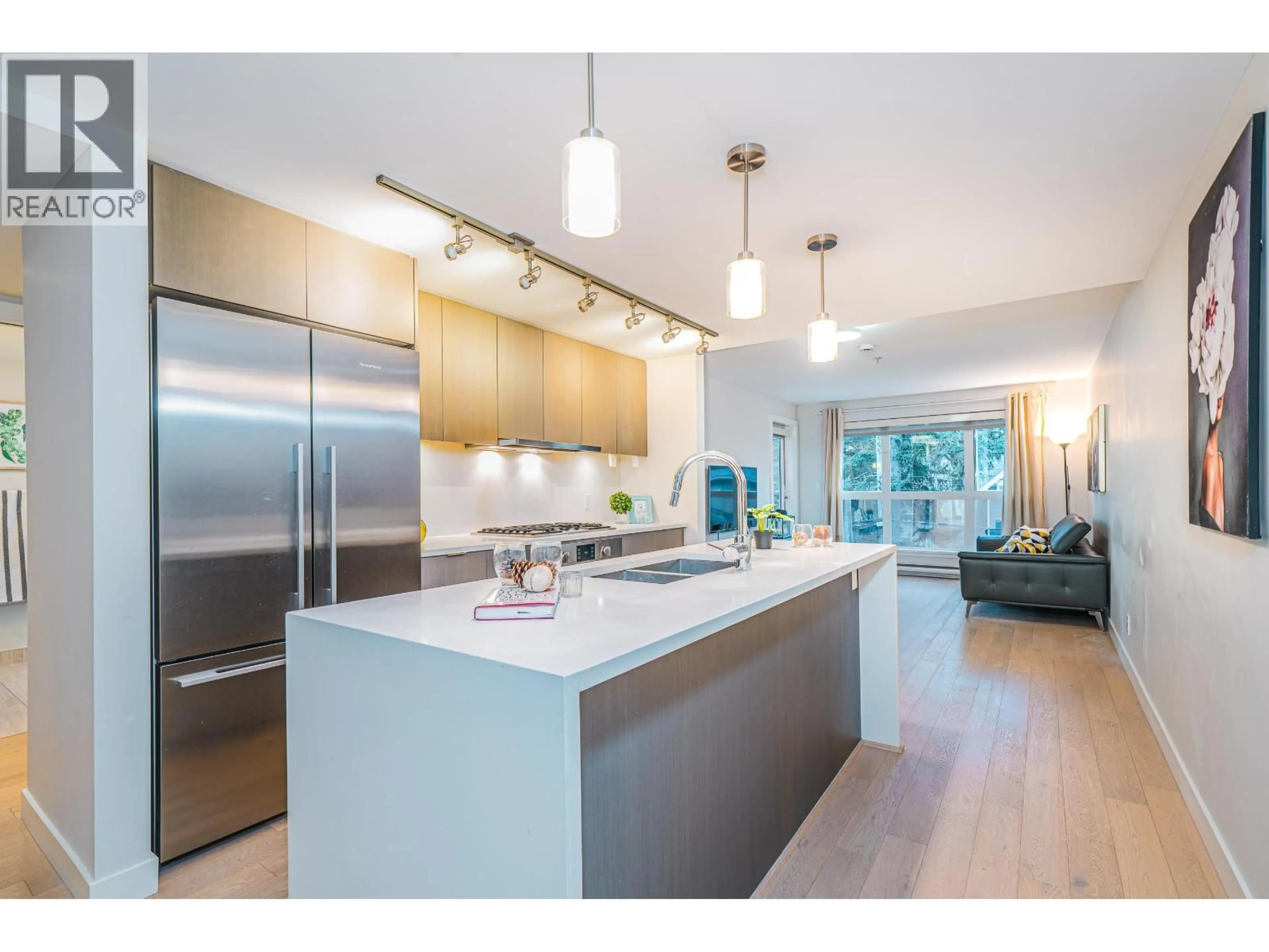 Open concept kitchen, wood/laminate floor for 311 - 5555 DUNBAR STREET, Vancouver British Columbia V6N1W5