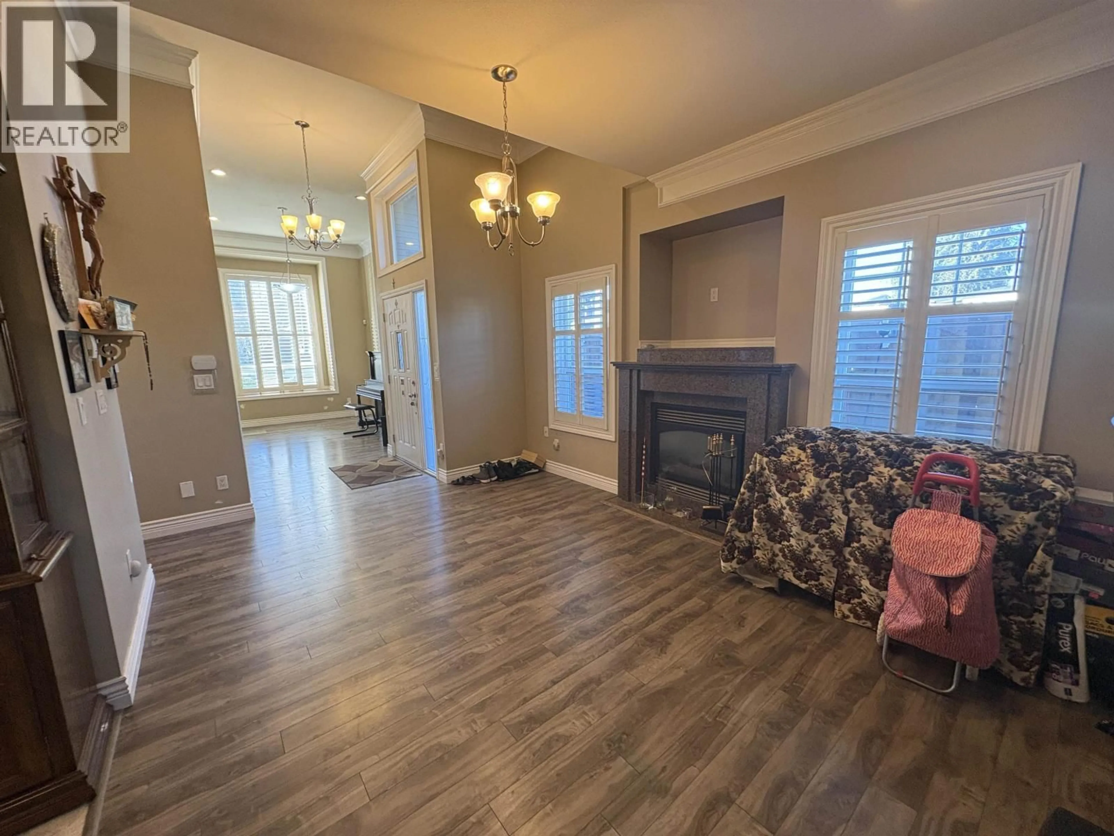 Living room with furniture, wood/laminate floor for 6916 CUNNINGHAM COURT, Burnaby British Columbia V5E0B1