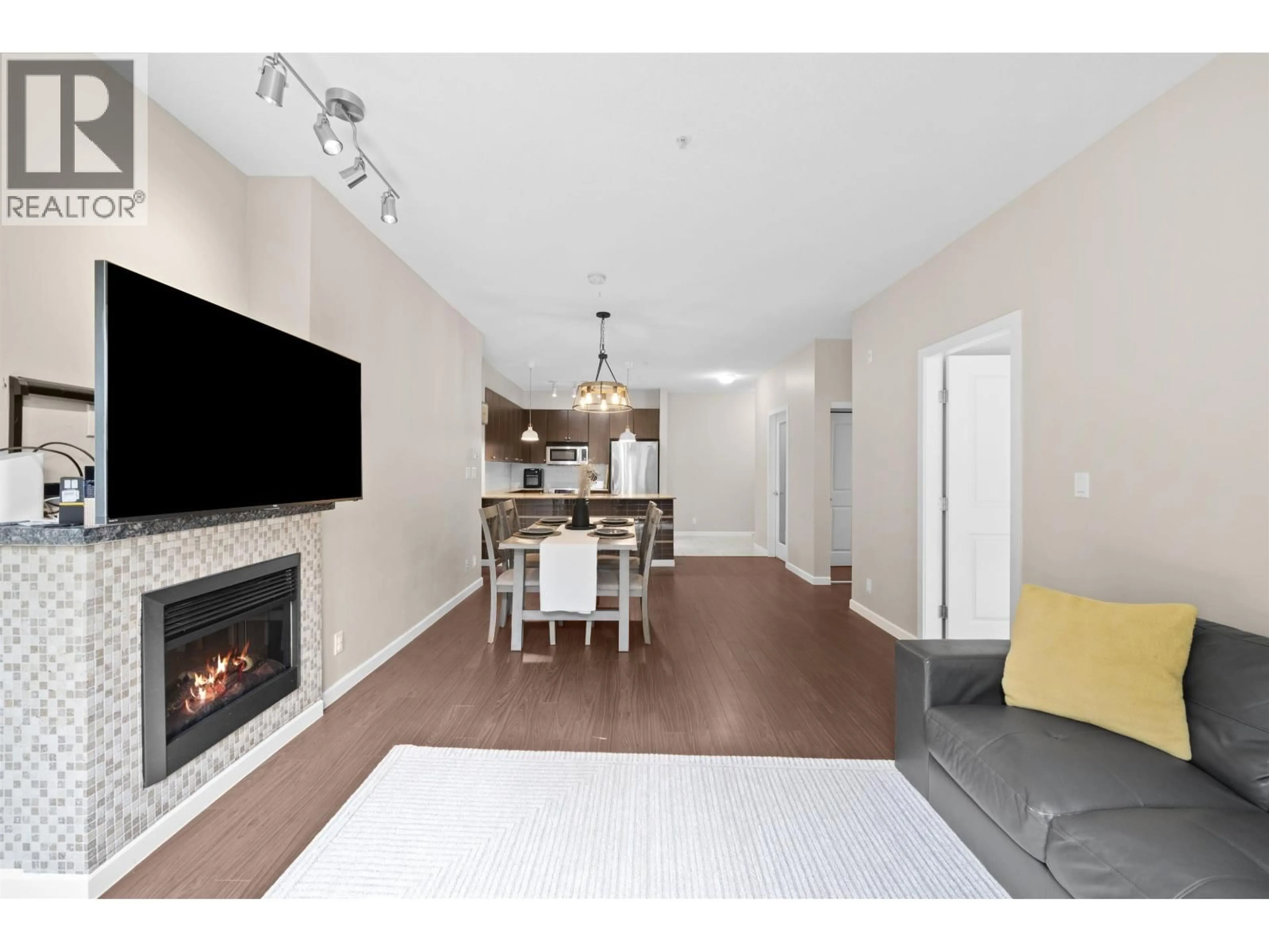 Living room with furniture, wood/laminate floor for 209 - 270 FRANCIS WAY, New Westminster British Columbia V3L0C3