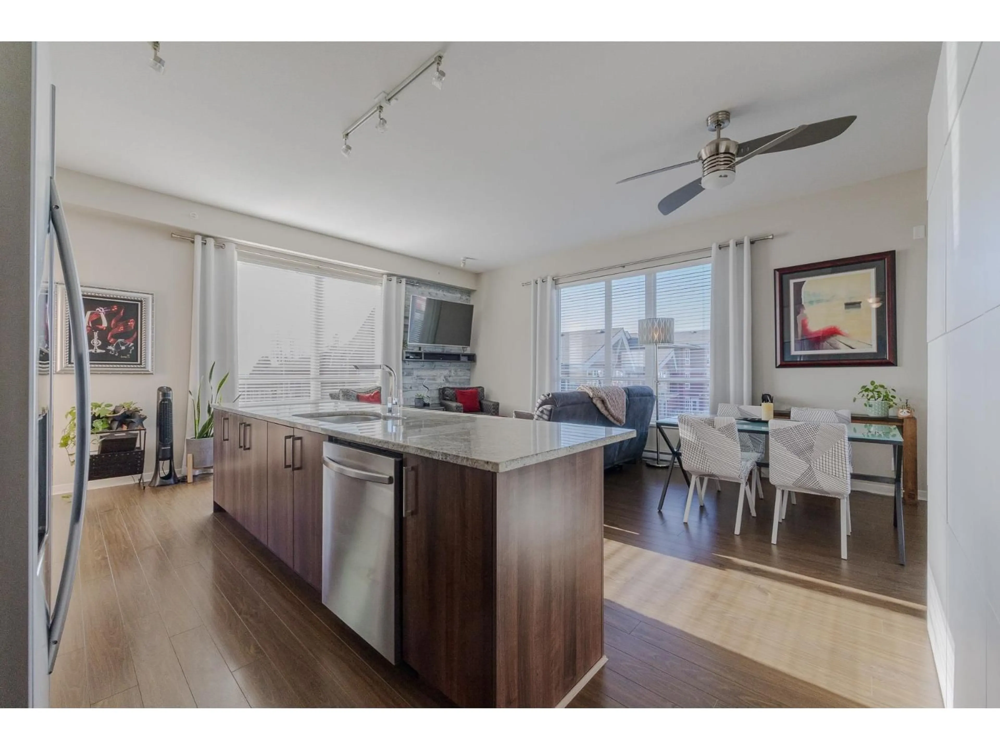 Open concept kitchen, wood/laminate floor for 407 - 6450 194 STREET, Surrey British Columbia V4N6J8